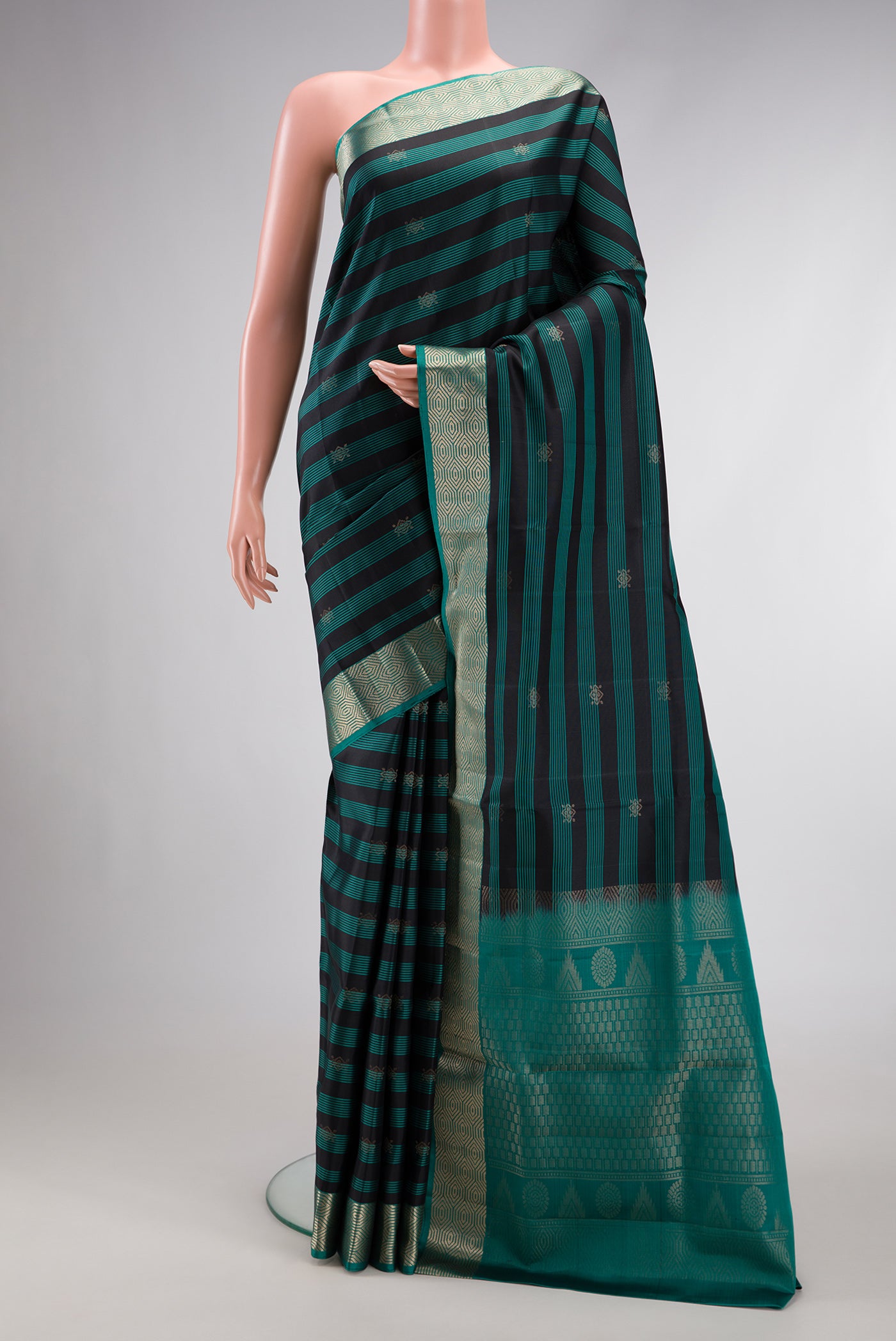Maya Blue Dual Tone Soft Silk Saree with Stripes on the body and Zari Border.  displayed on a mannequin