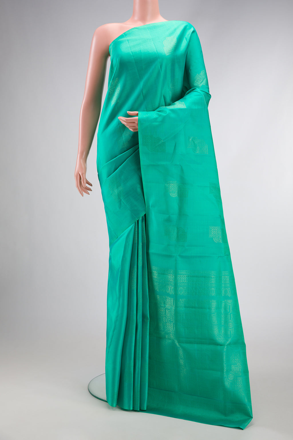 Sea Green Dual Tone Kanjivaram Silk Saree with Zari Butta on the body and Without Border.  displayed on a mannequin