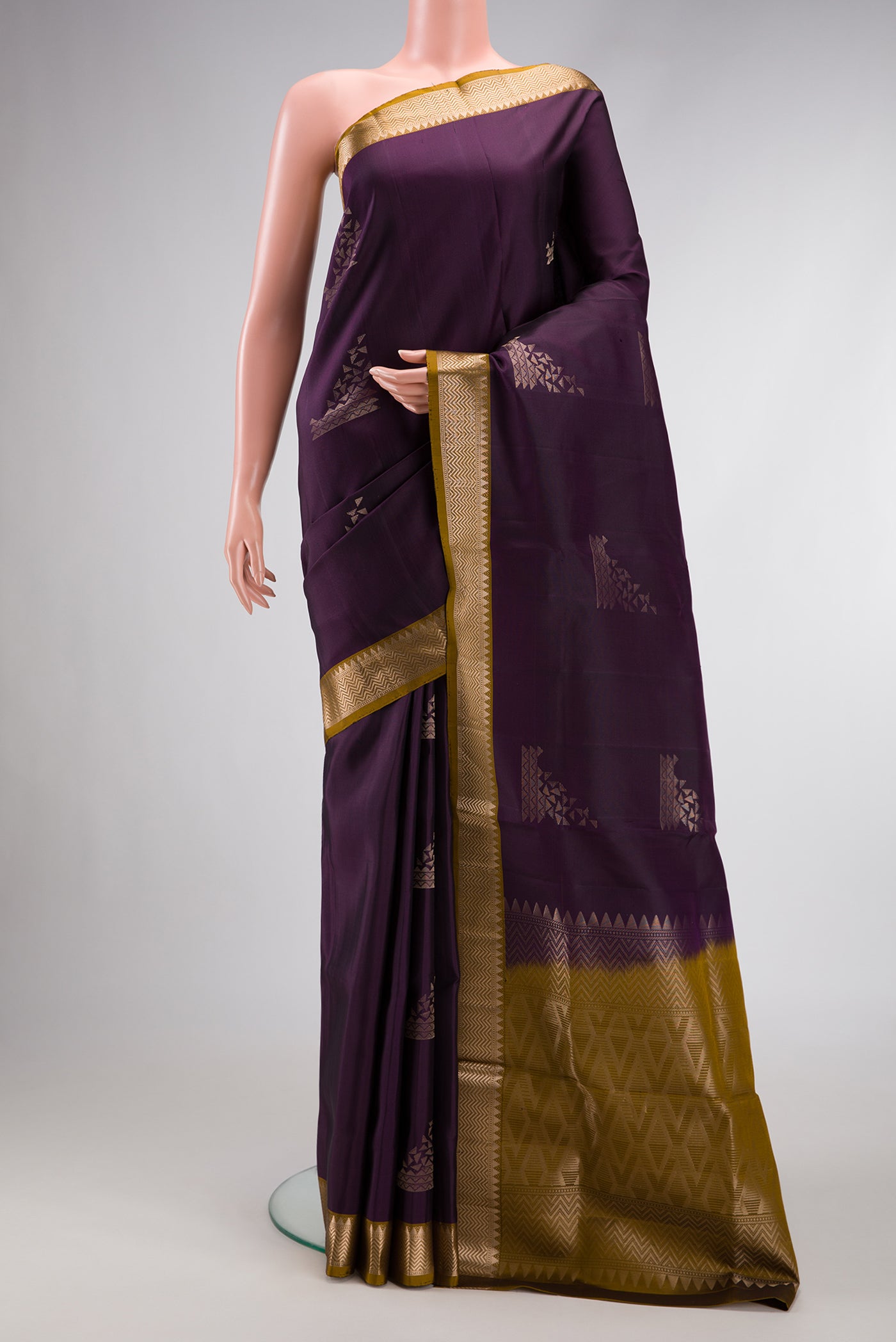 Burgundy Dual Tone Soft Silk Saree with Zari Butta on the body and Zari Border.  displayed on a mannequin