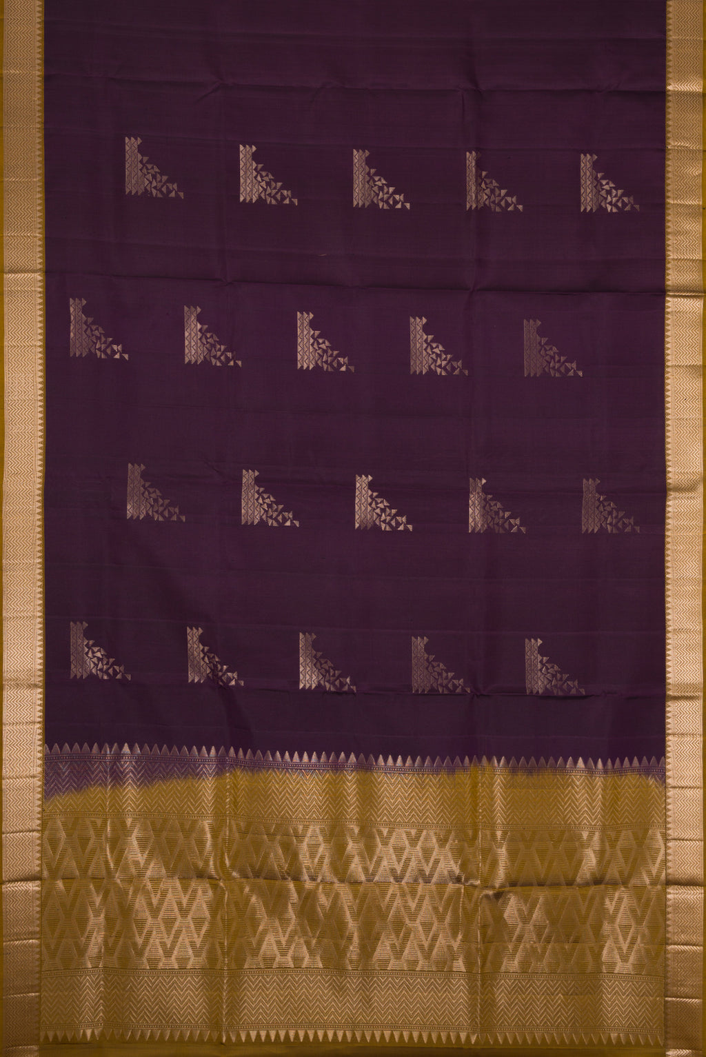 Flat view of Burgundy Dual Tone Soft Silk Saree with Zari Butta on the body and Zari Border. 