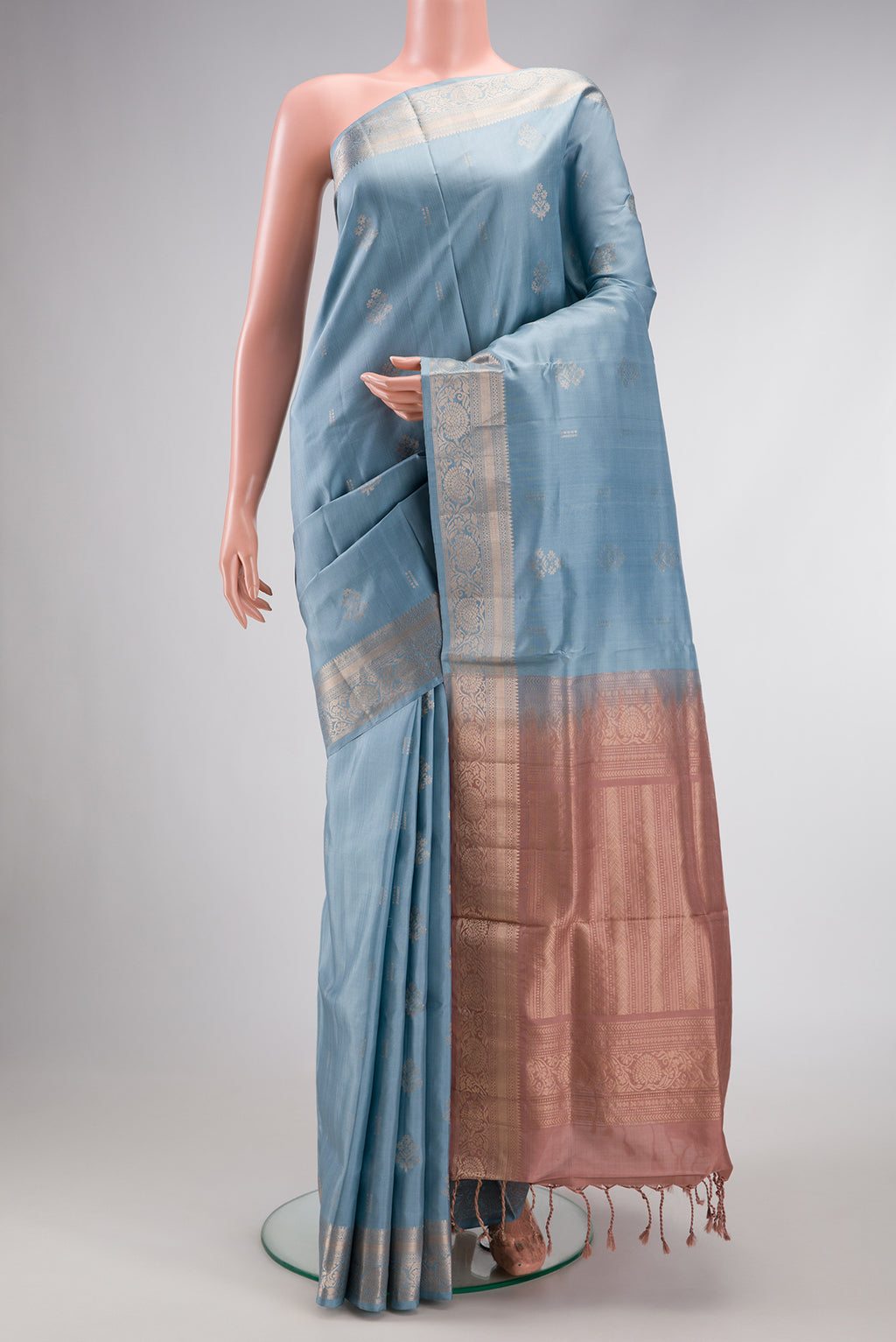 Light Blue Dual Tone Soft Silk Saree with Zari Butta on the body and Zari Border.  displayed on a mannequin