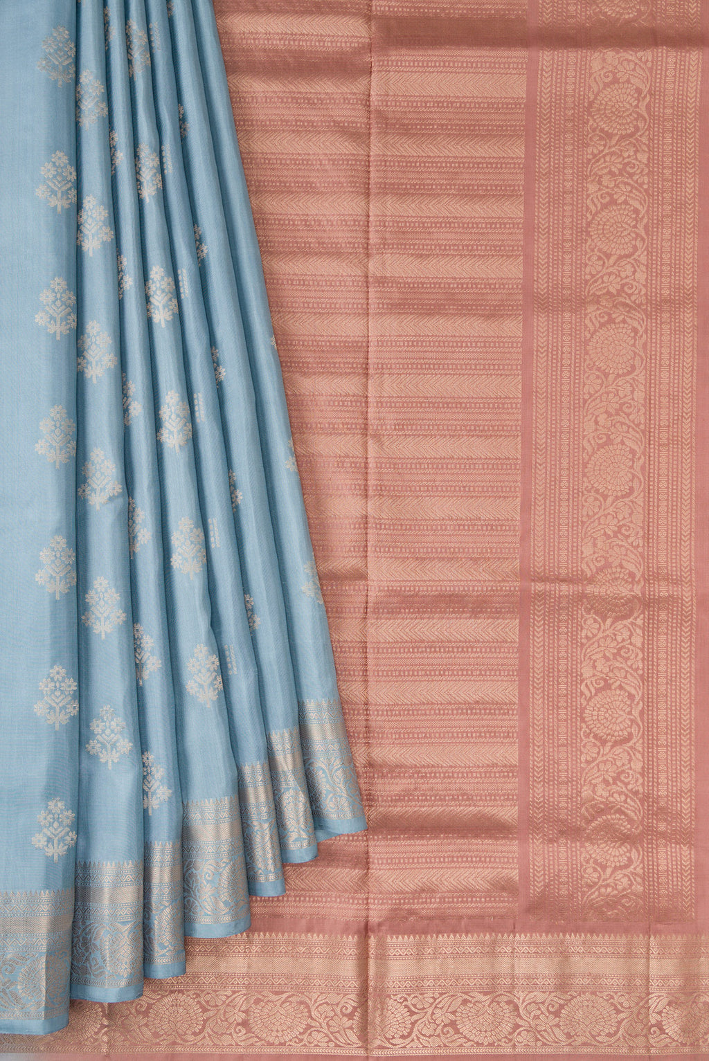 Pleats and pallu of Light Blue Dual Tone Soft Silk Saree with Zari Butta on the body and Zari Border. 