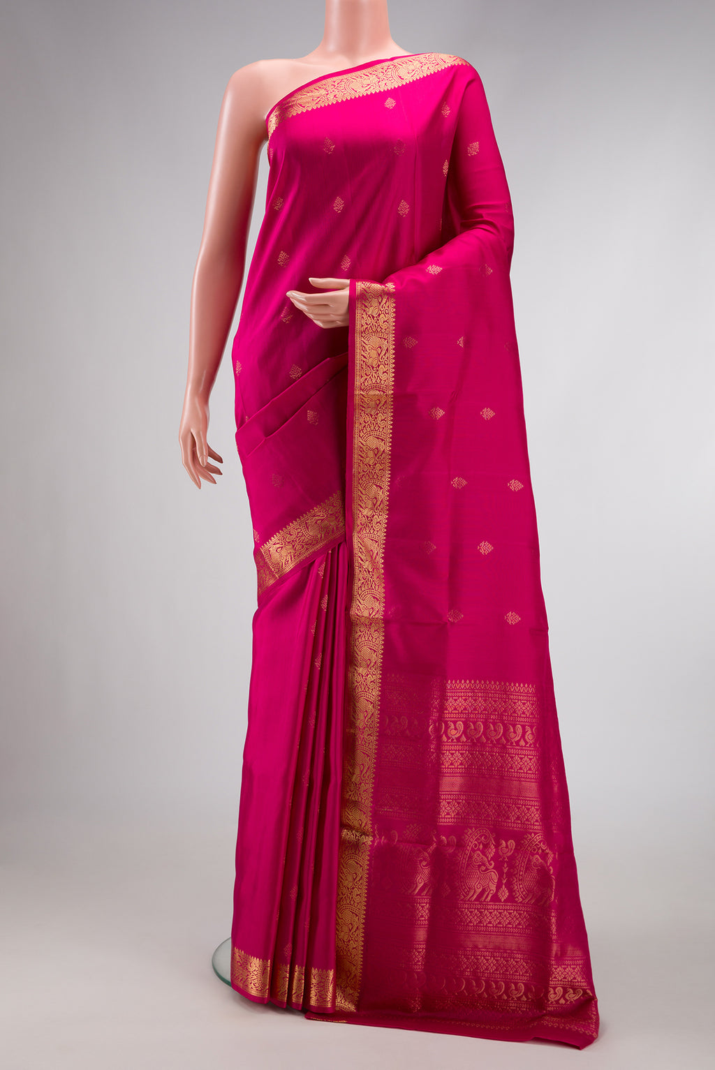Dark Pink Dual Tone Soft Silk Saree with Zari Butta on the body and Zari Border.  displayed on a mannequin
