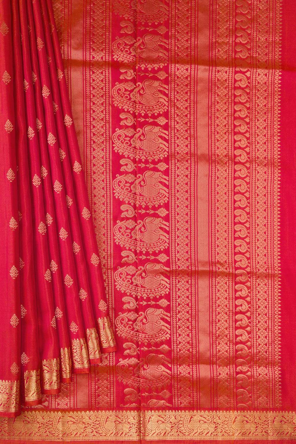 Pleats and pallu of Brick Orange Dual Tone Soft Silk Saree with Zari Butta on the body and Zari Border. 
