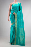 Sky Blue Dual Tone Soft Silk Saree with Zari Butta on the body and Zari Border.  displayed on a mannequin