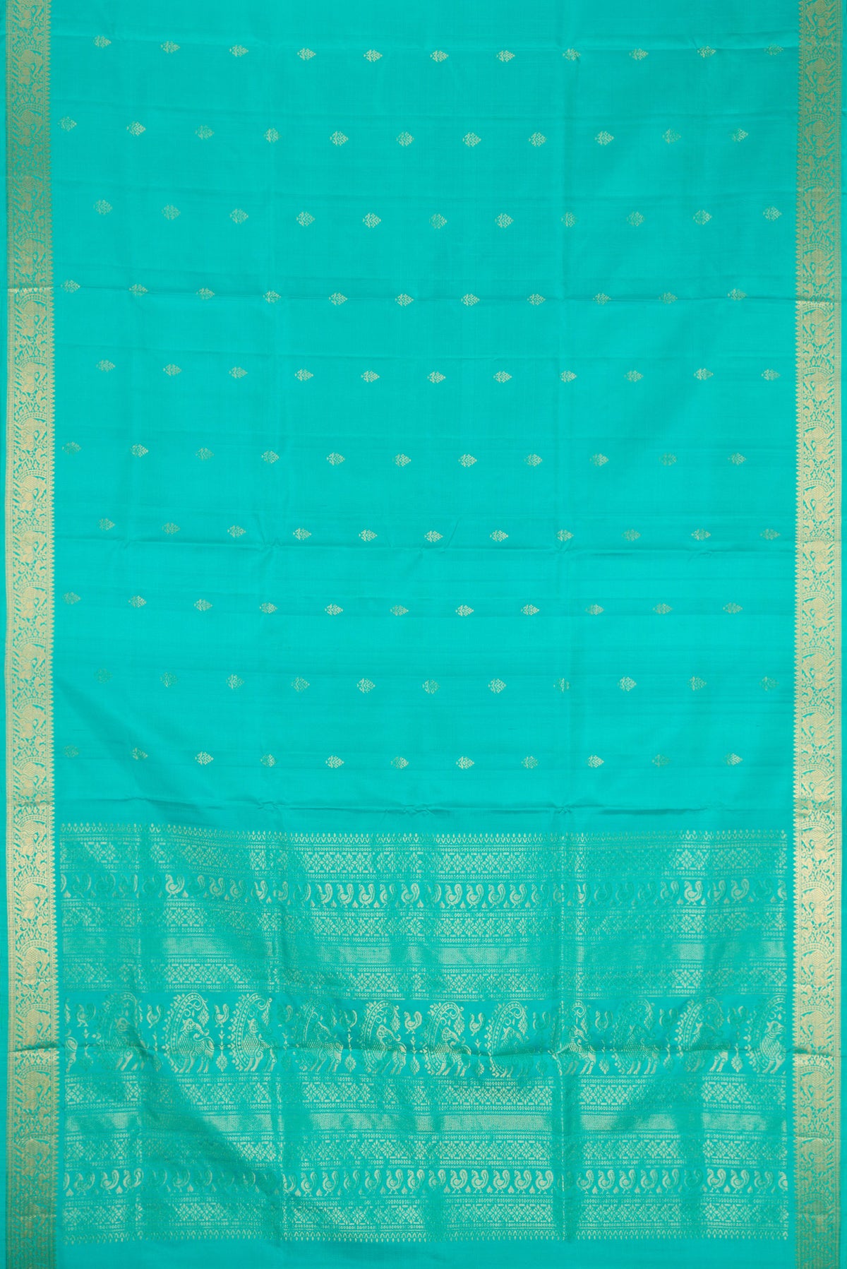 Flat view of Sky Blue Dual Tone Soft Silk Saree with Zari Butta on the body and Zari Border. 