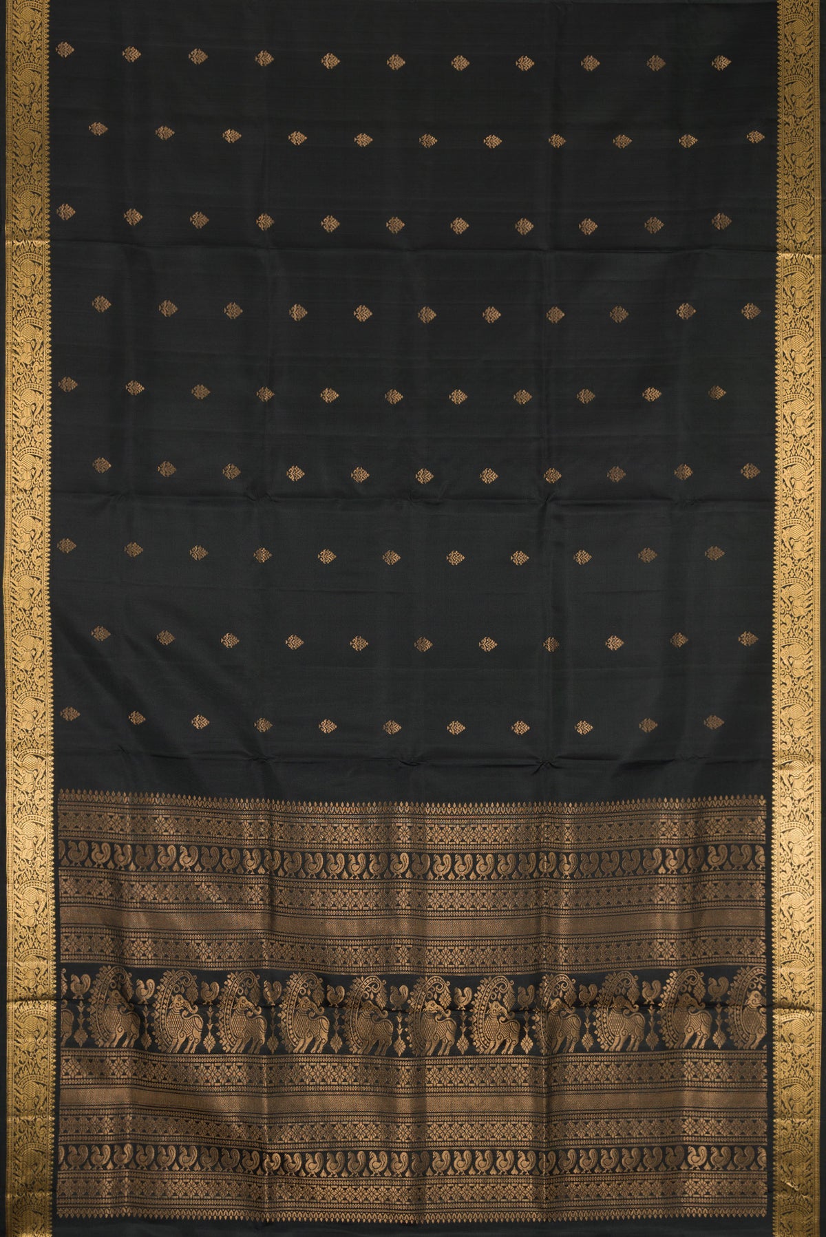Flat view of Black Dual Tone Soft Silk Saree with Zari Butta on the body and Zari Border. 