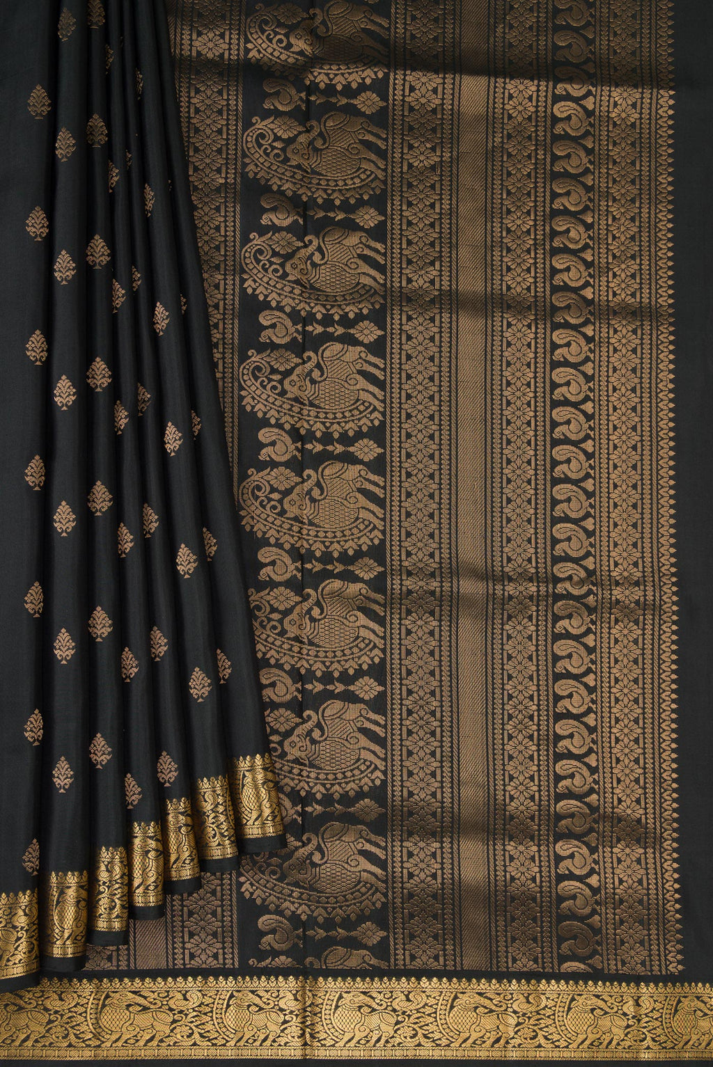 Pleats and pallu of Black Dual Tone Soft Silk Saree with Zari Butta on the body and Zari Border. 