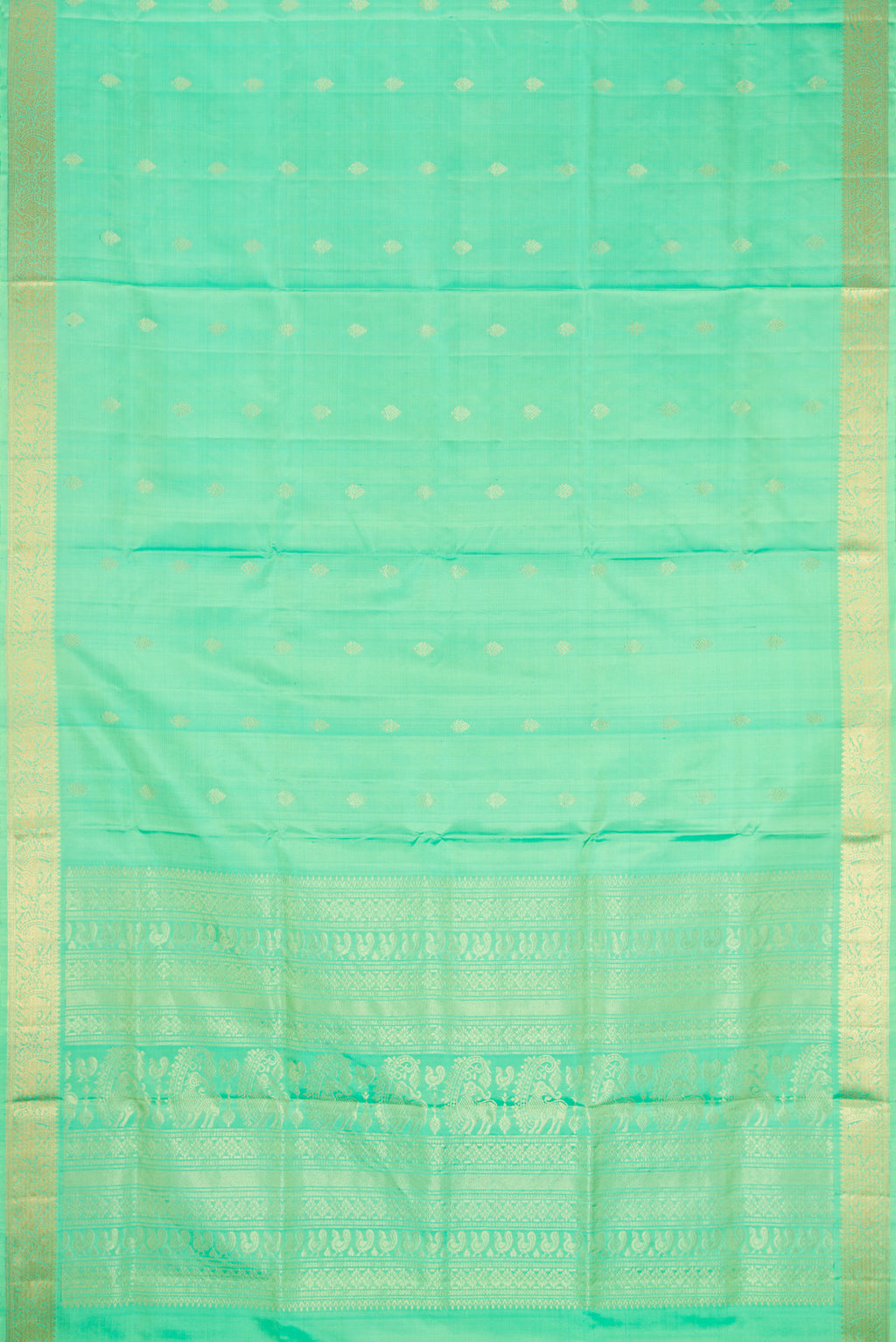 Flat view of Pista Green Dual Tone Soft Silk Saree with Zari Butta on the body and Zari Border. 
