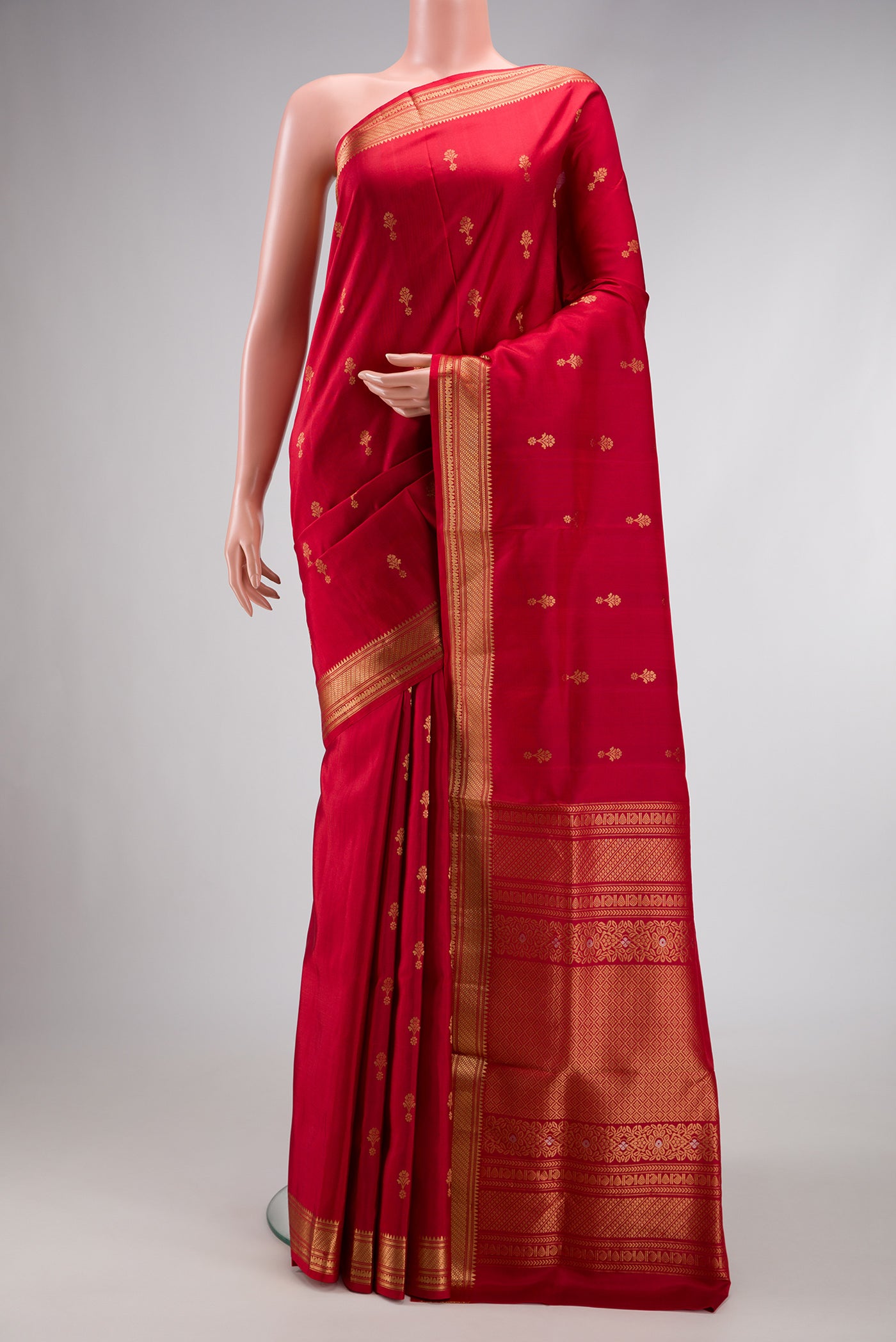 Red Dual Tone Soft Silk Saree with Zari Butta on the body and Zari Border.  displayed on a mannequin