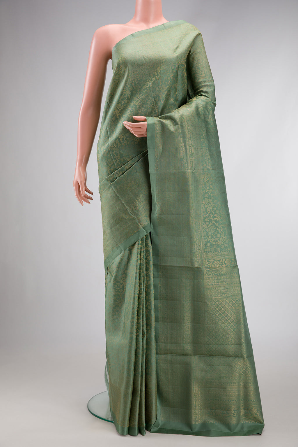 Light Green Dual Tone Soft Silk Saree with Zari Brocade on the body and Zari Border.  displayed on a mannequin