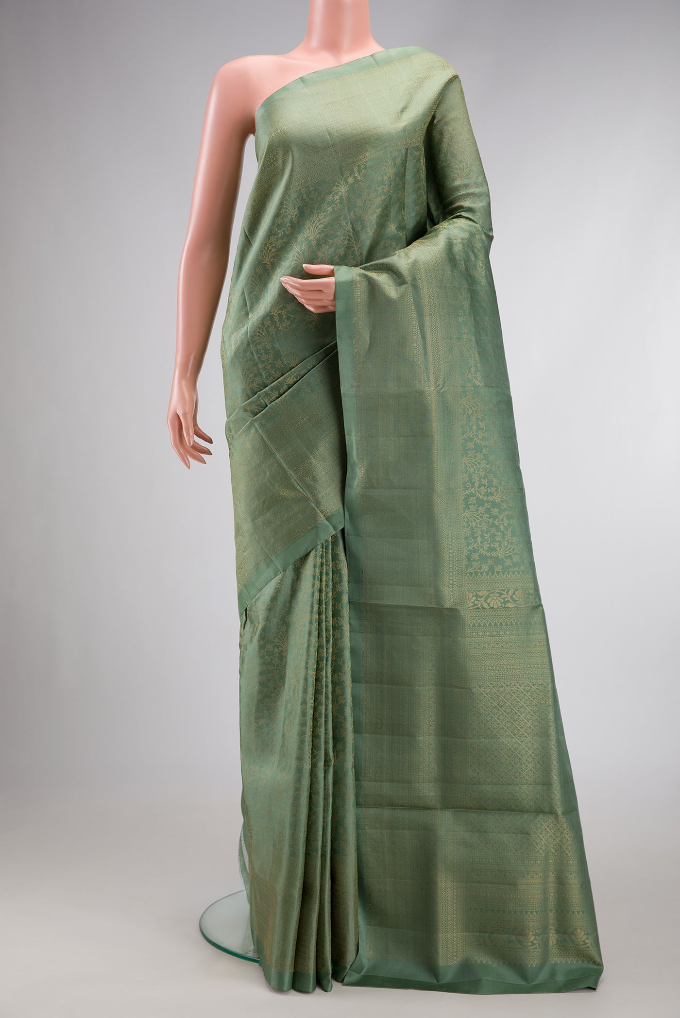 Light Green Dual Tone Soft Silk Saree with Zari Brocade on the body and Zari Border.  displayed on a mannequin