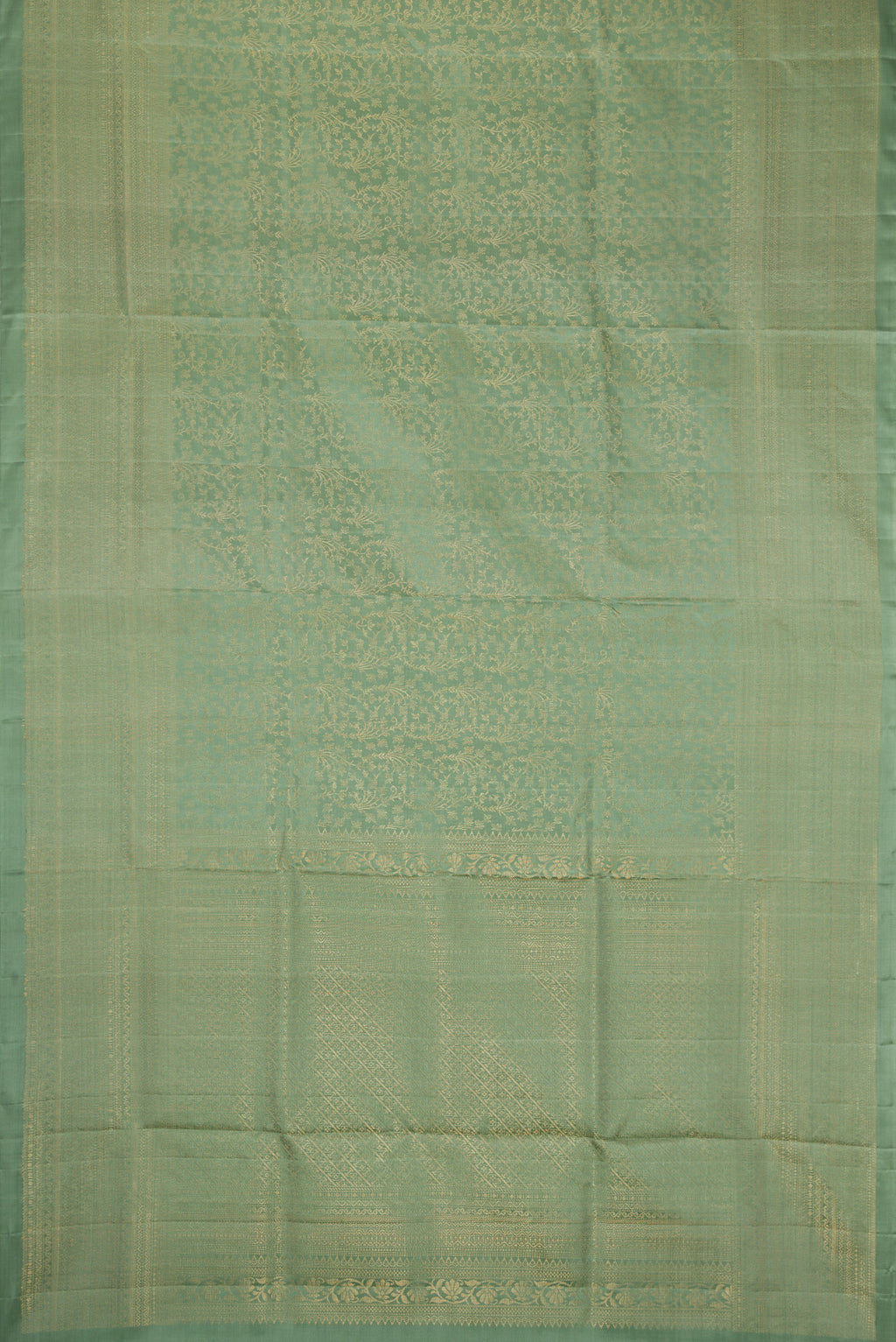 Flat view of Light Green Dual Tone Soft Silk Saree with Zari Brocade on the body and Zari Border. 