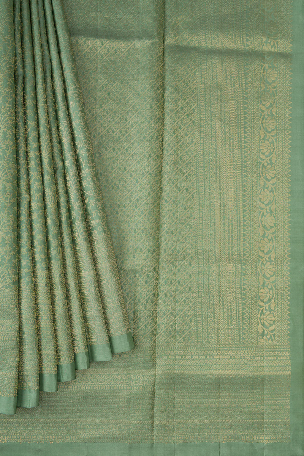 Pleats and pallu of Light Green Dual Tone Soft Silk Saree with Zari Brocade on the body and Zari Border. 