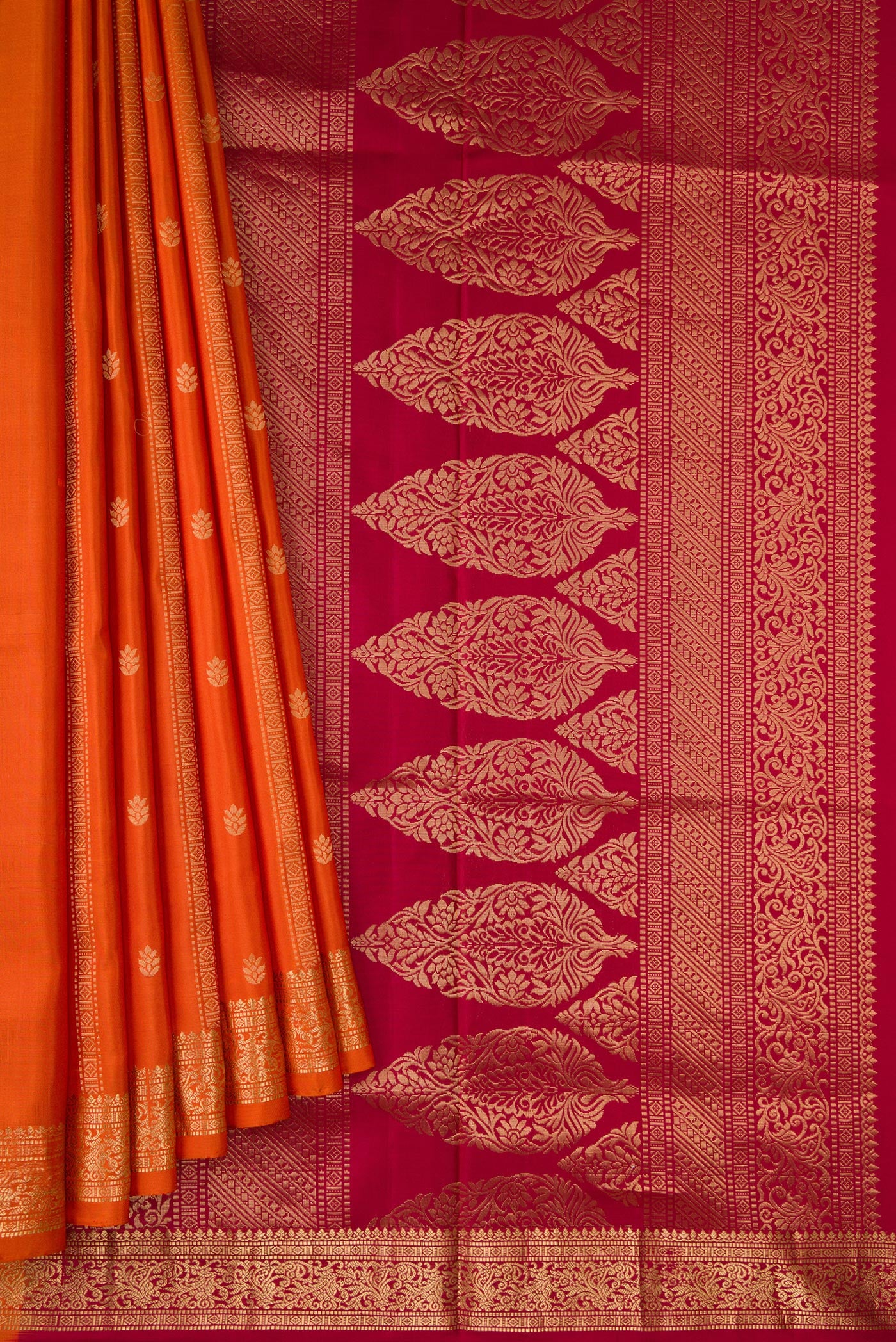 Pleats and pallu of Brick Orange Dual Tone Soft Silk Saree with Stripes on the body and Zari Border. 