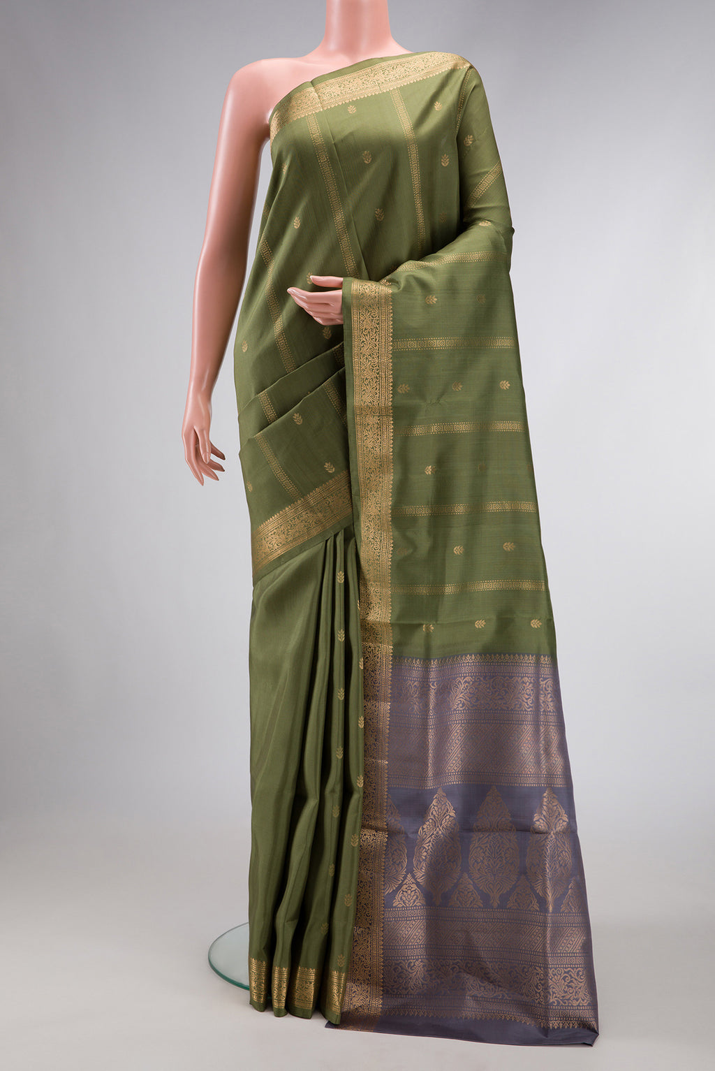 Mehandi Green Dual Tone Soft Silk Saree with Zari Butta on the body and Zari Border.  displayed on a mannequin
