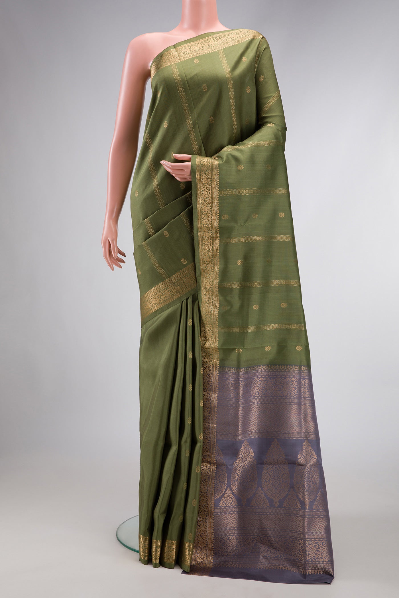 Mehandi Green Dual Tone Soft Silk Saree with Zari Butta on the body and Zari Border.  displayed on a mannequin