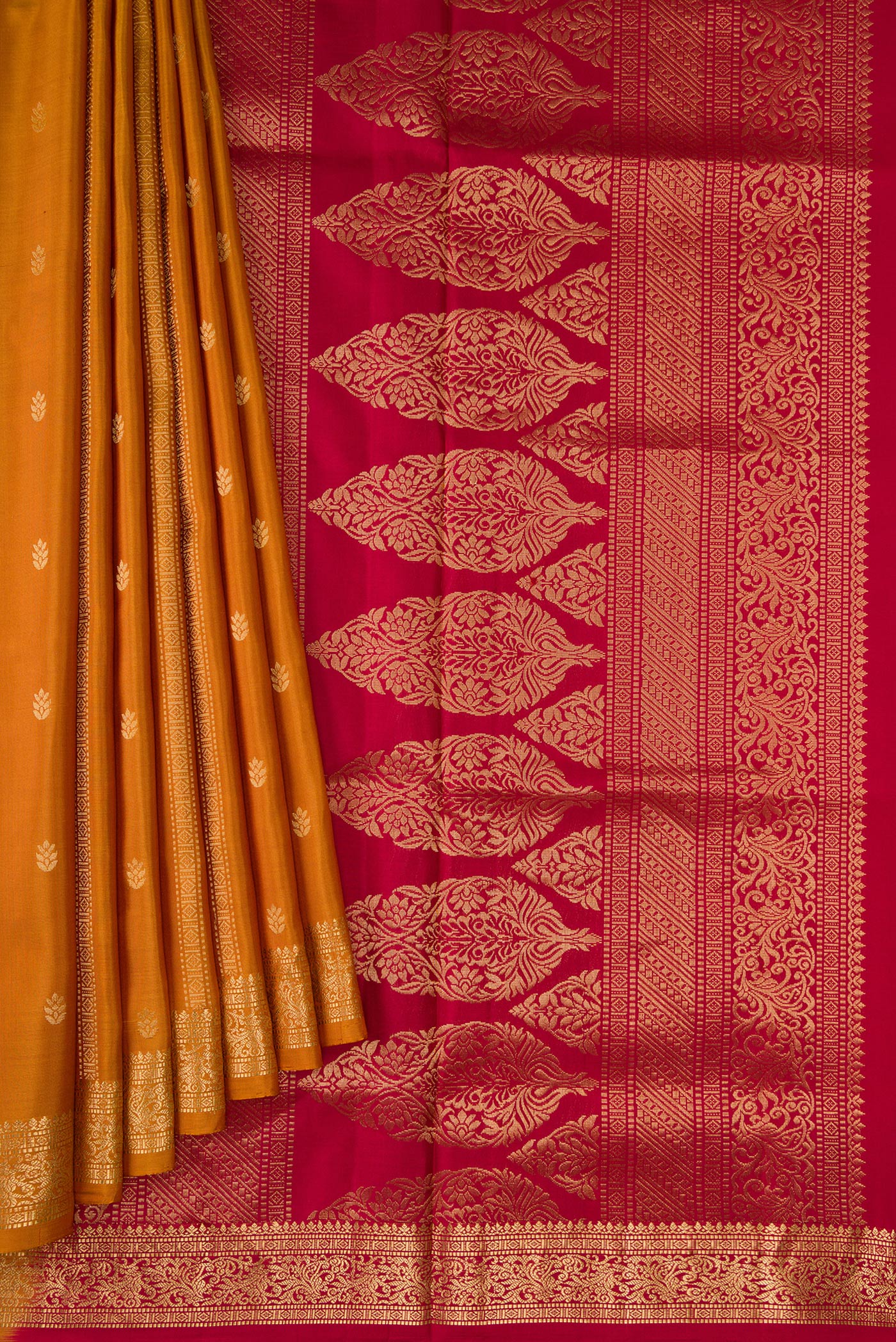 Pleats and pallu of Mustard Dual Tone Soft Silk Saree with Zari Butta on the body and Zari Border. 