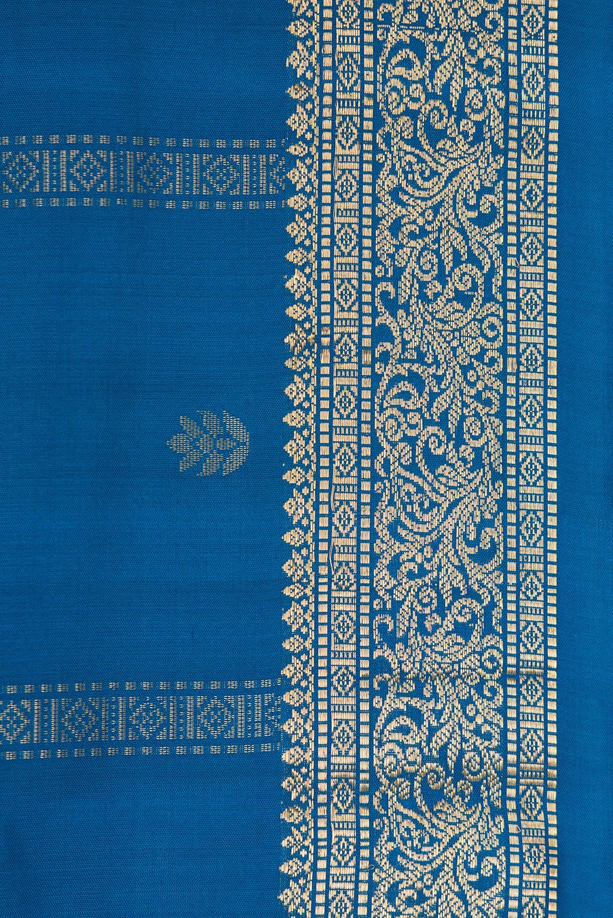 Border image of Peacock Blue Dual Tone Soft Silk Saree with Zari Butta on the body and Zari Border. 