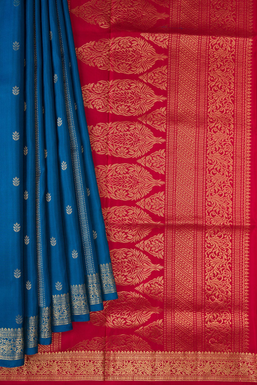 Pleats and pallu of Peacock Blue Dual Tone Soft Silk Saree with Zari Butta on the body and Zari Border. 