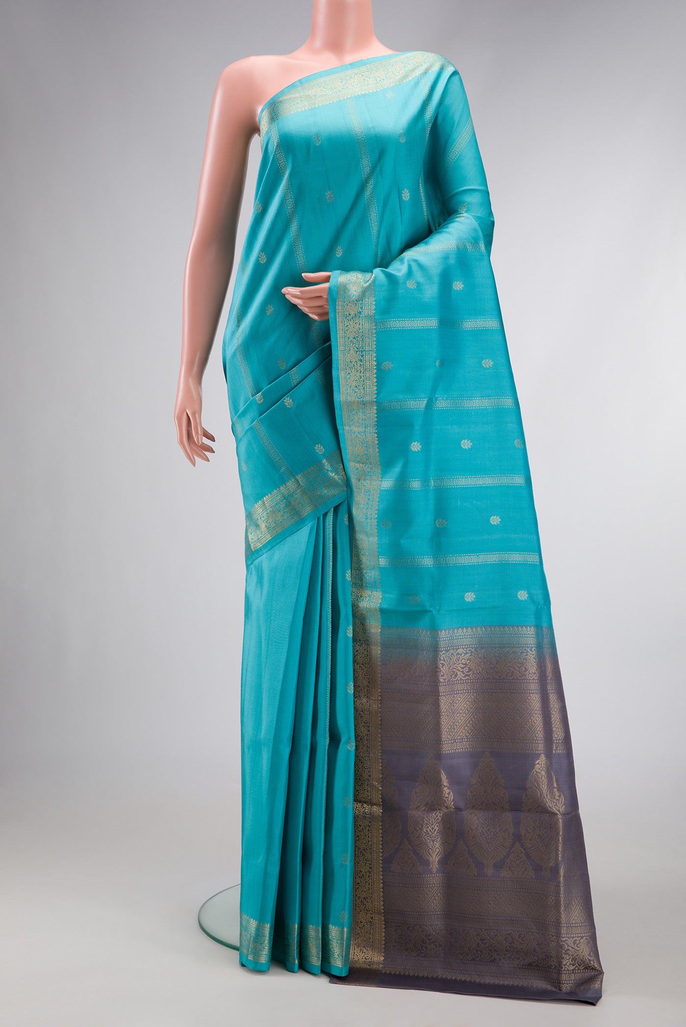 Sky Blue Dual Tone Soft Silk Saree with Zari Butta on the body and Zari Border.  displayed on a mannequin