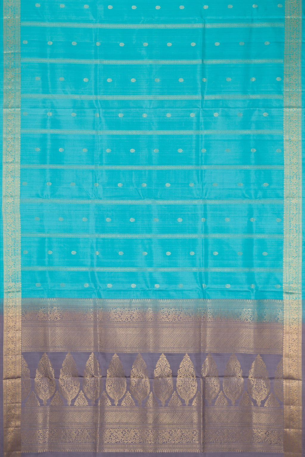 Flat view of Sky Blue Dual Tone Soft Silk Saree with Zari Butta on the body and Zari Border. 