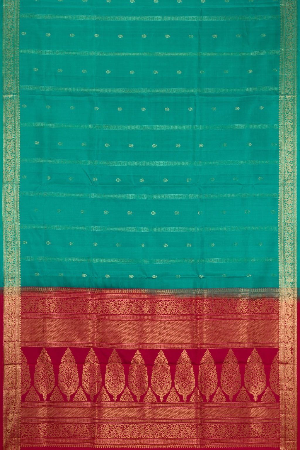 Flat view of Green Dual Tone Soft Silk Saree with Zari Butta on the body and Zari Border. 