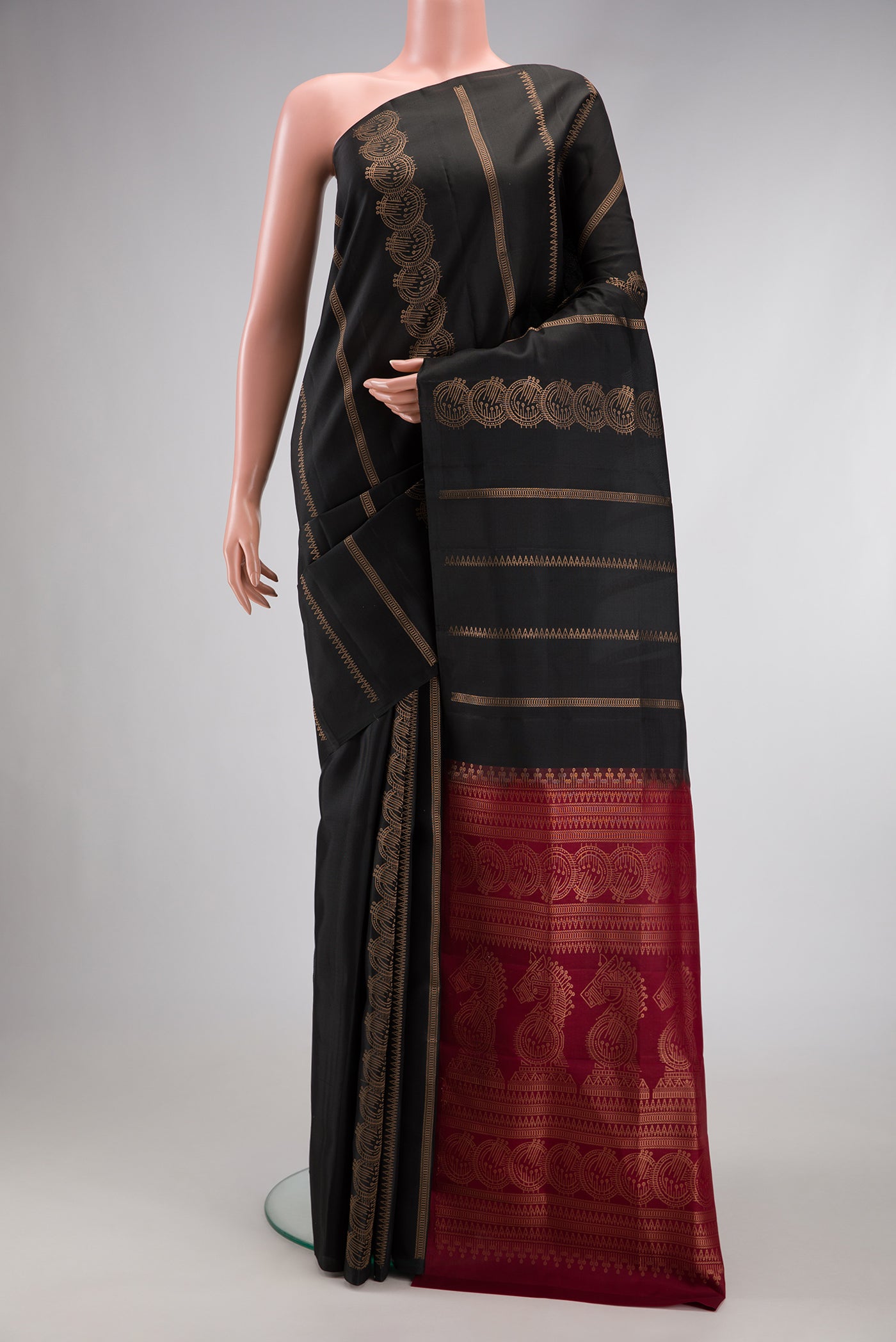 Black Dual Tone Soft Silk Saree with Stripes on the body and Without Border.  displayed on a mannequin