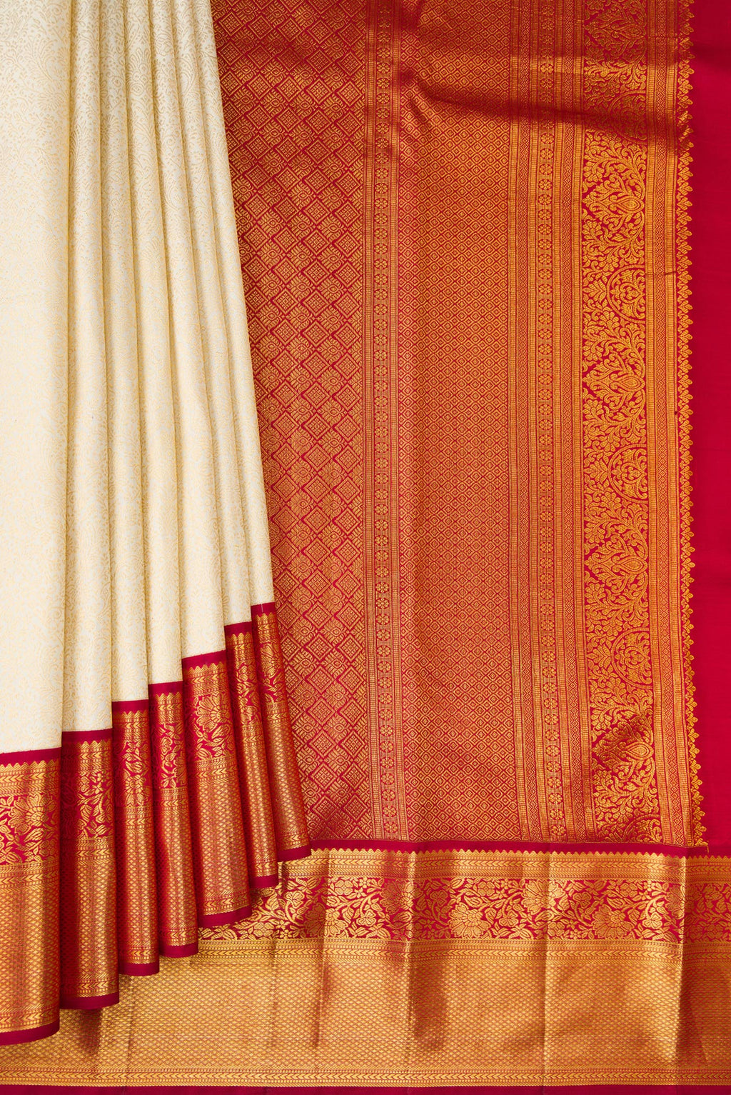 Pleats and pallu of Off White Kanjivaram Silk Saree with Zari Brocade on the body and Zari Border. 