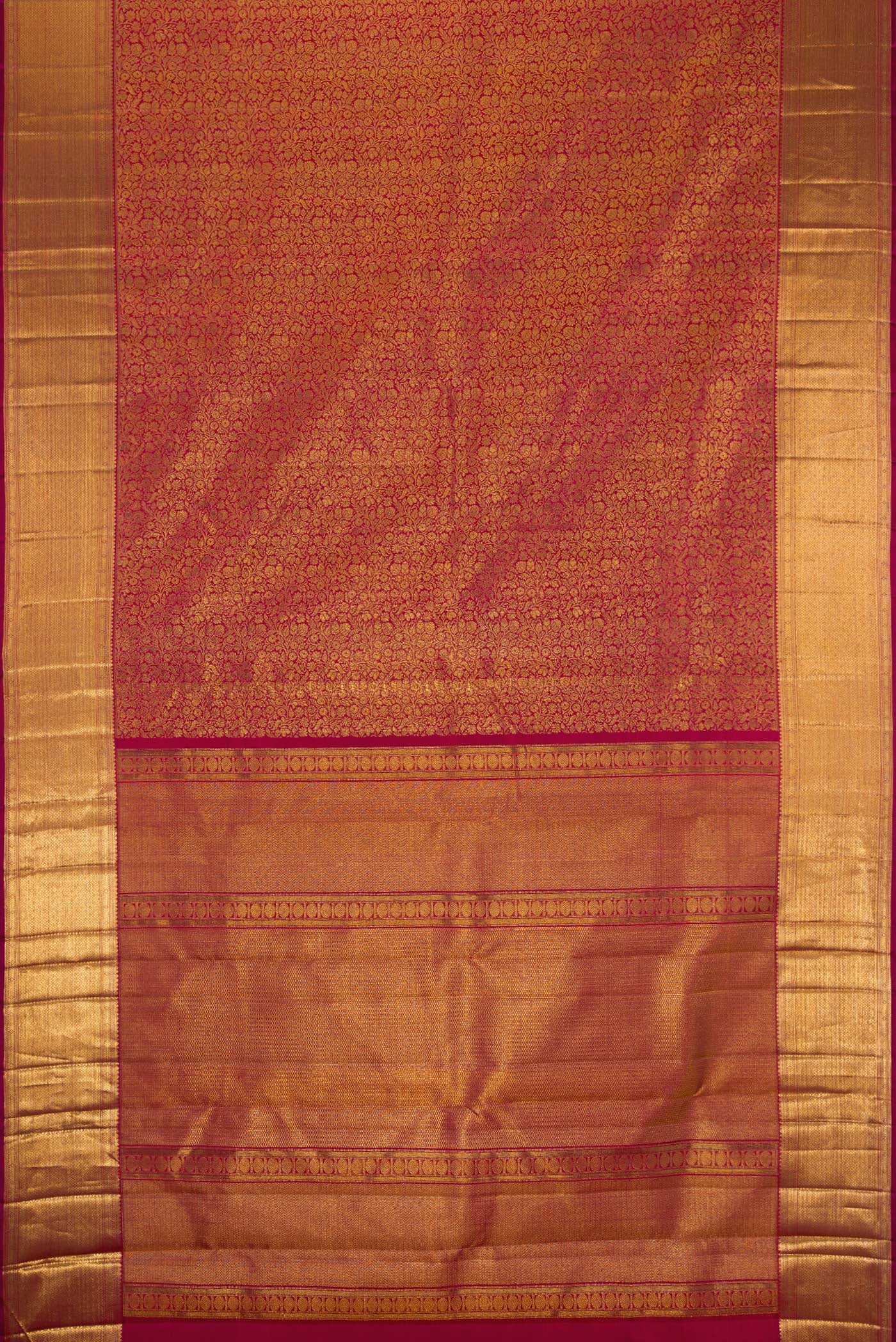 Flat view of Maroon Dual Tone Kanchipuram Silk Saree with Zari Brocade on the body and Zari Border. 