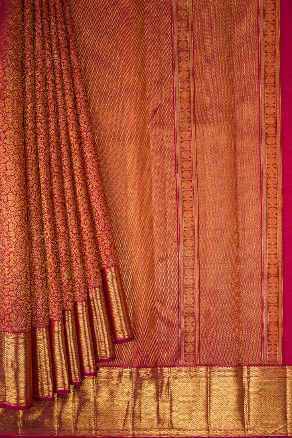 Pleats and pallu of Maroon Dual Tone Kanchipuram Silk Saree with Zari Brocade on the body and Zari Border. 