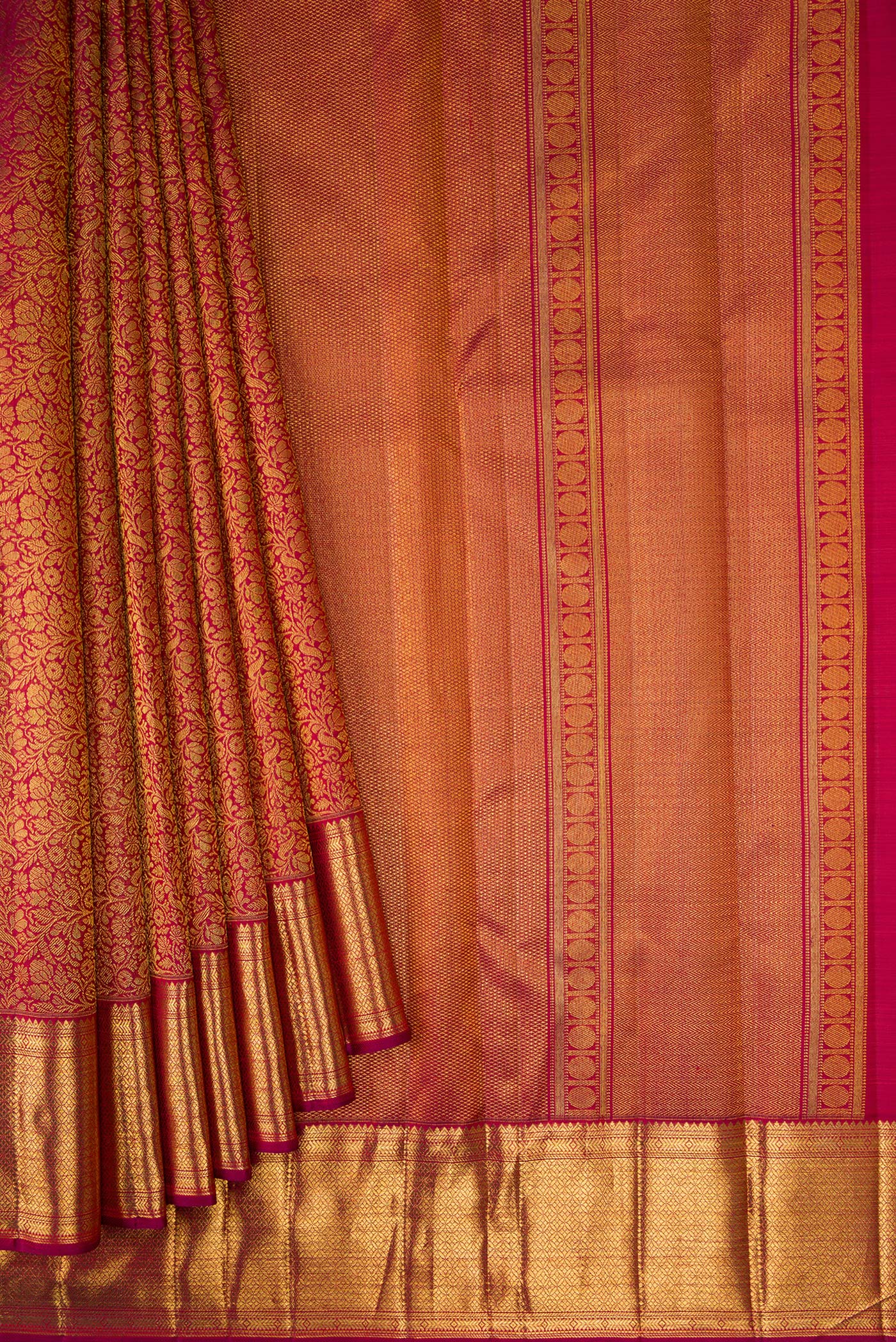 Pleats and pallu of Maroon Dual Tone Kanchipuram Silk Saree with Zari Brocade on the body and Zari Border. 