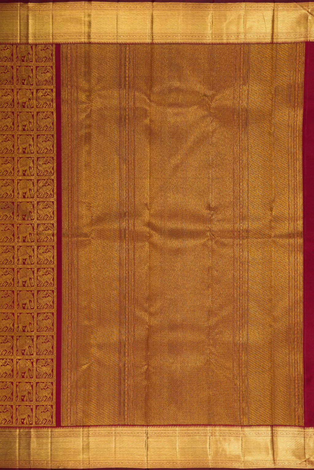 Close up image of the pallu of Maroon Dual Tone Kanchipuram Silk Saree with Zari Brocade on the body and Zari Border. 