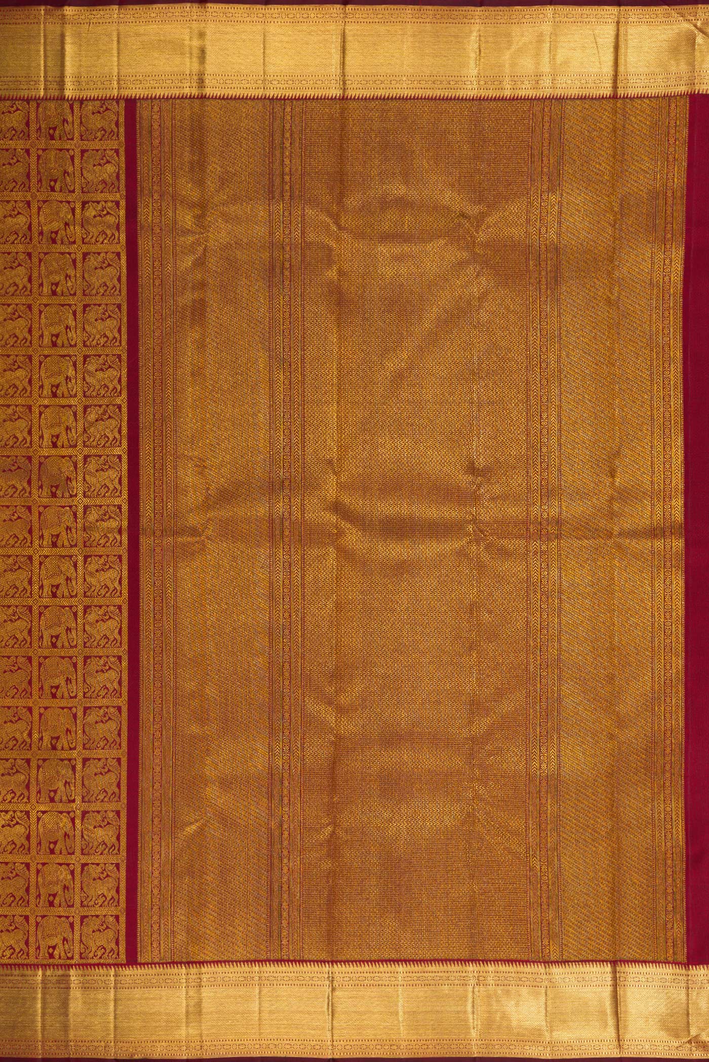 Close up image of the pallu of Maroon Dual Tone Kanchipuram Silk Saree with Zari Brocade on the body and Zari Border. 