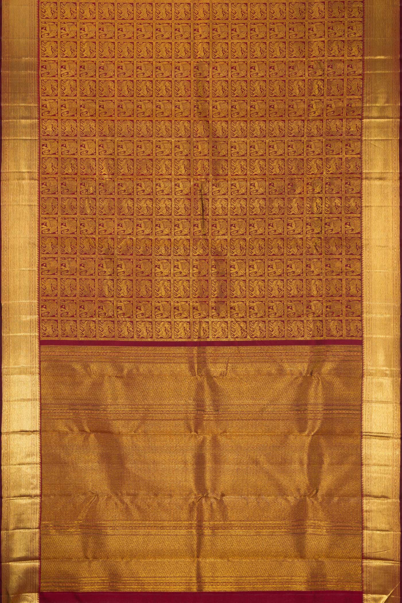 Flat view of Maroon Dual Tone Kanchipuram Silk Saree with Zari Brocade on the body and Zari Border. 