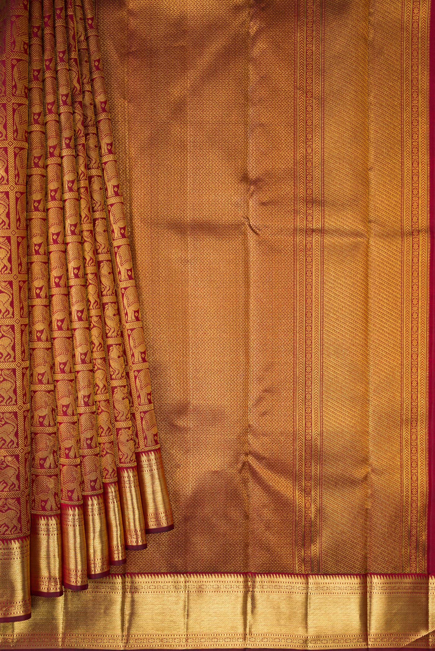 Pleats and pallu of Maroon Dual Tone Kanchipuram Silk Saree with Zari Brocade on the body and Zari Border. 