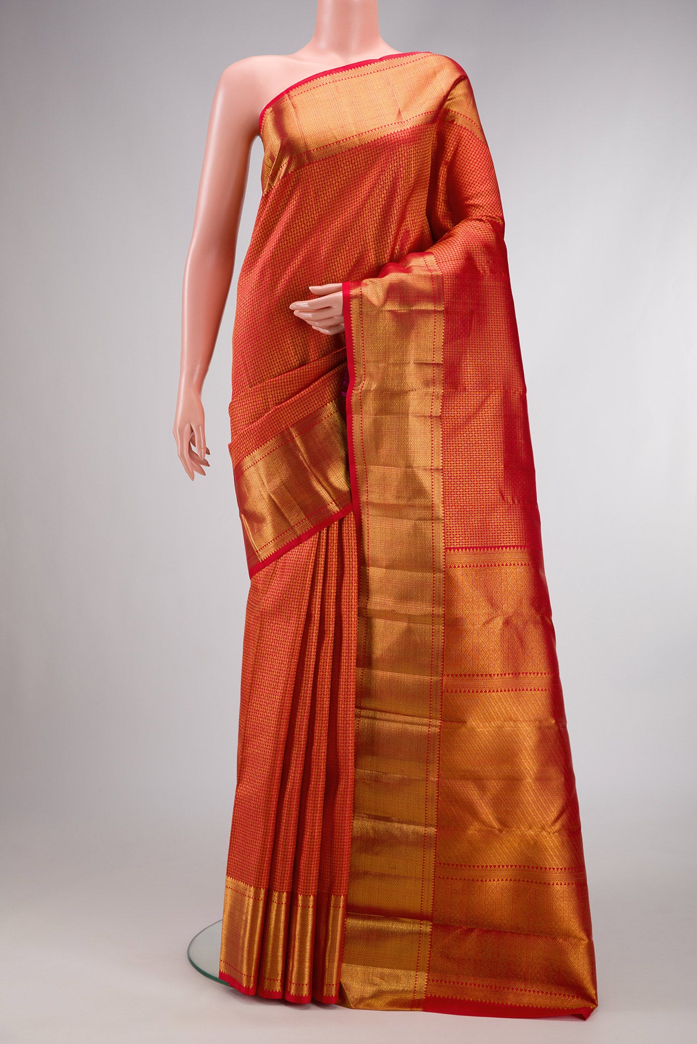 Red Dual Tone Kanchipuram Silk Saree with Zari Brocade on the body and Zari Border.  displayed on a mannequin