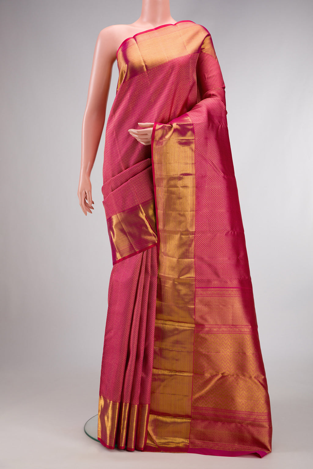 Pink Dual Tone Kanchipuram Silk Saree with Zari Brocade on the body and Zari Border.  displayed on a mannequin