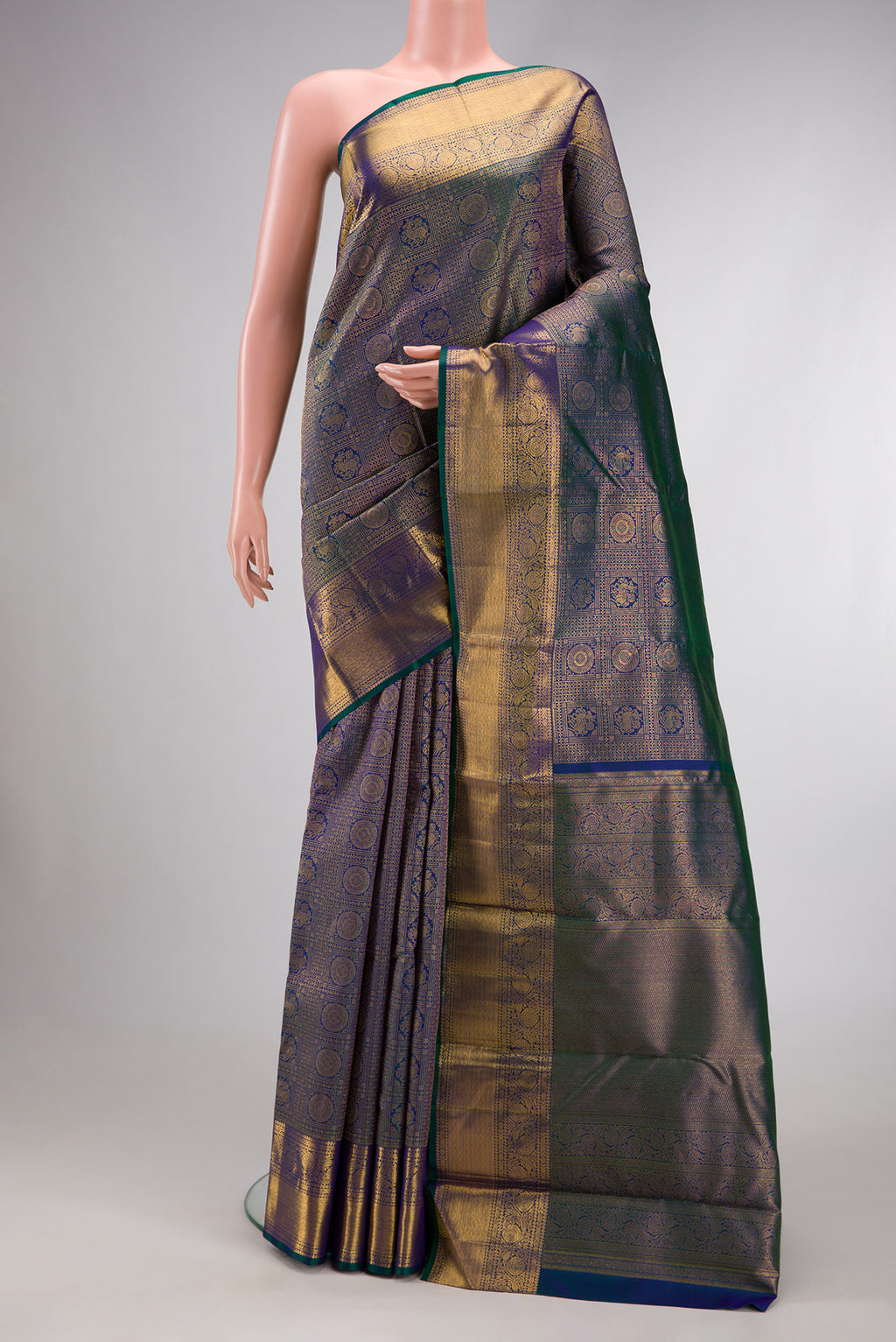 Peacock Blue Dual Tone Kanchipuram Silk Saree with Zari Brocade on the body and Zari Border.  displayed on a mannequin