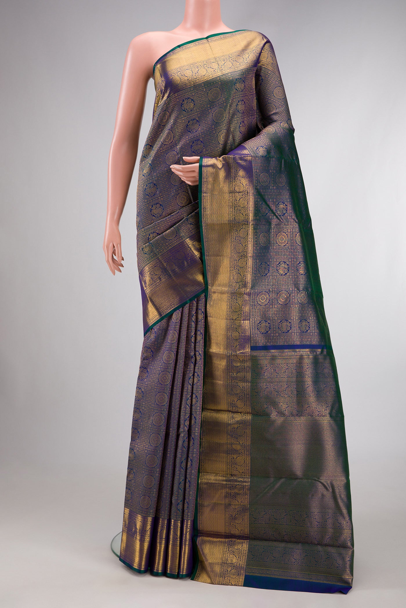 Peacock Blue Dual Tone Kanchipuram Silk Saree with Zari Brocade on the body and Zari Border.  displayed on a mannequin