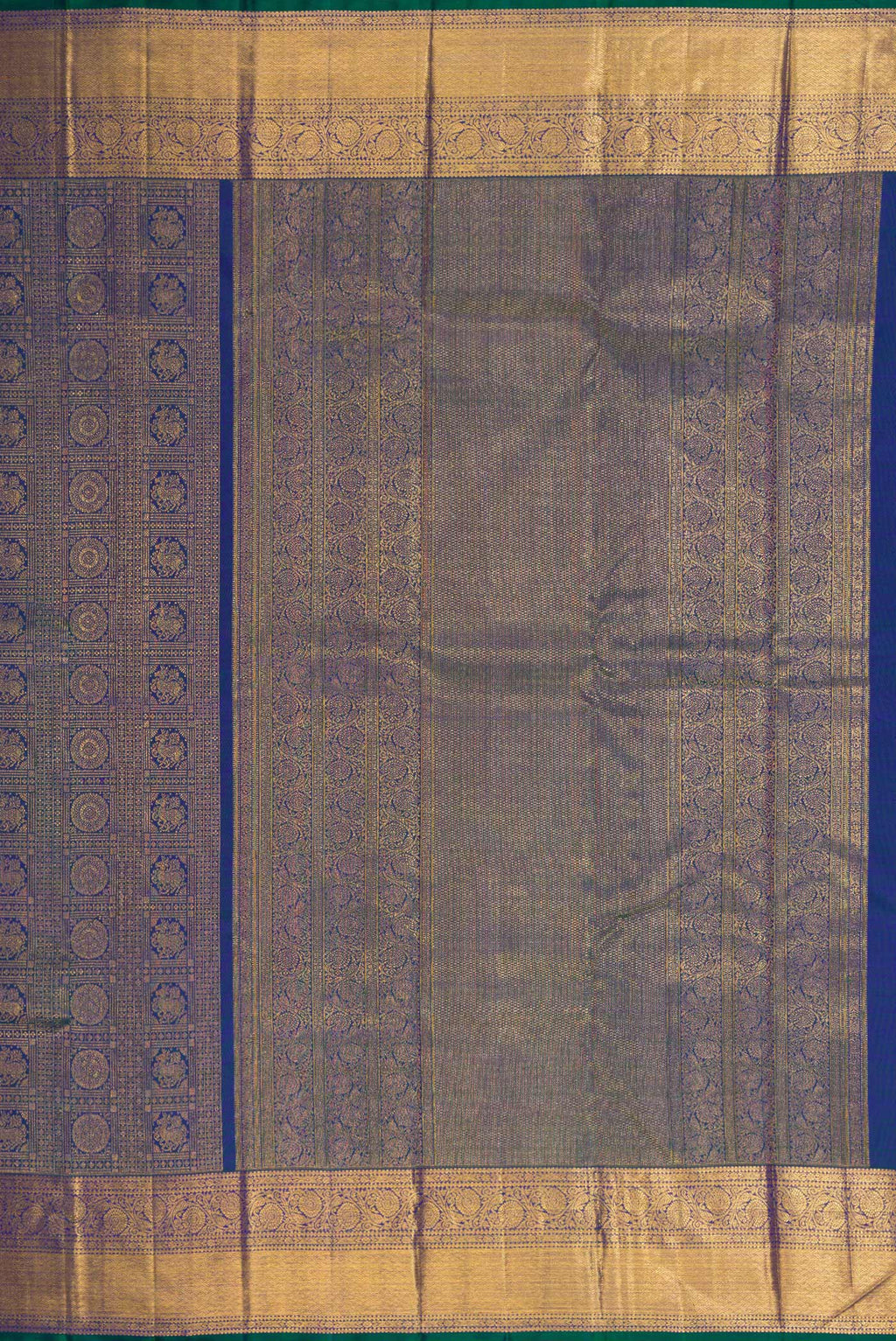 Close up image of the pallu of Peacock Blue Dual Tone Kanchipuram Silk Saree with Zari Brocade on the body and Zari Border. 