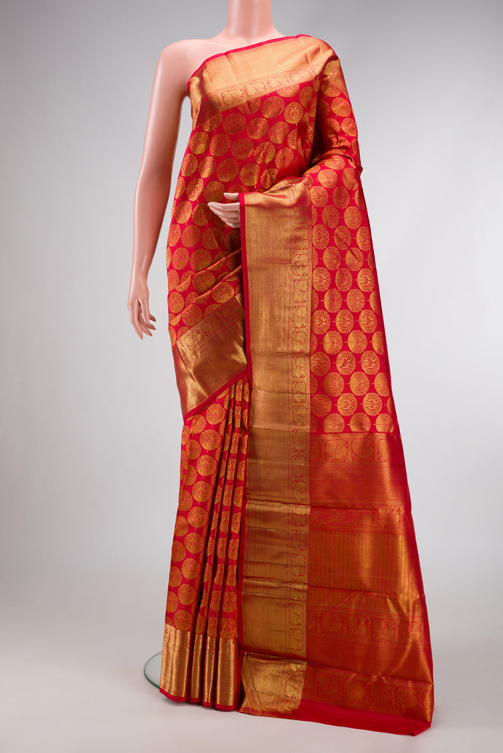 Red Dual Tone Kanchipuram Silk Saree with Zari Brocade on the body and Zari Border.  displayed on a mannequin