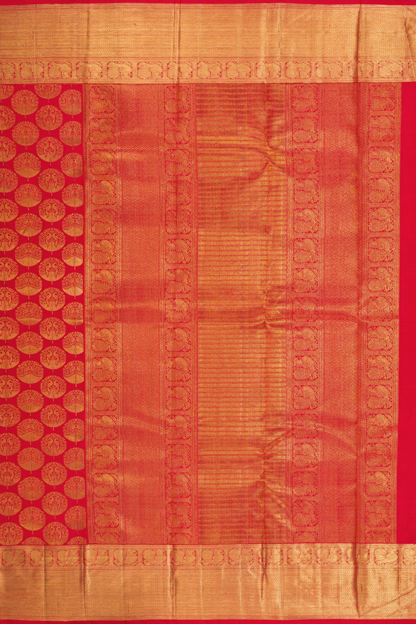 Close up image of the pallu of Red Dual Tone Kanchipuram Silk Saree with Zari Brocade on the body and Zari Border. 