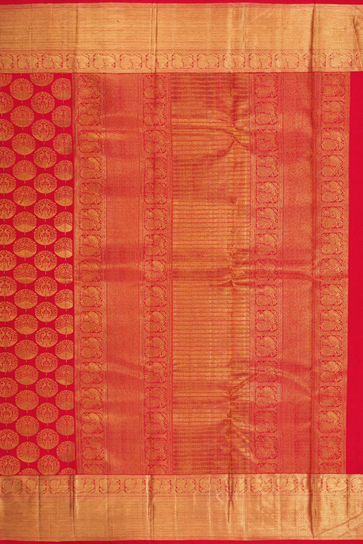 Close up image of the pallu of Red Dual Tone Kanchipuram Silk Saree with Zari Brocade on the body and Zari Border. 