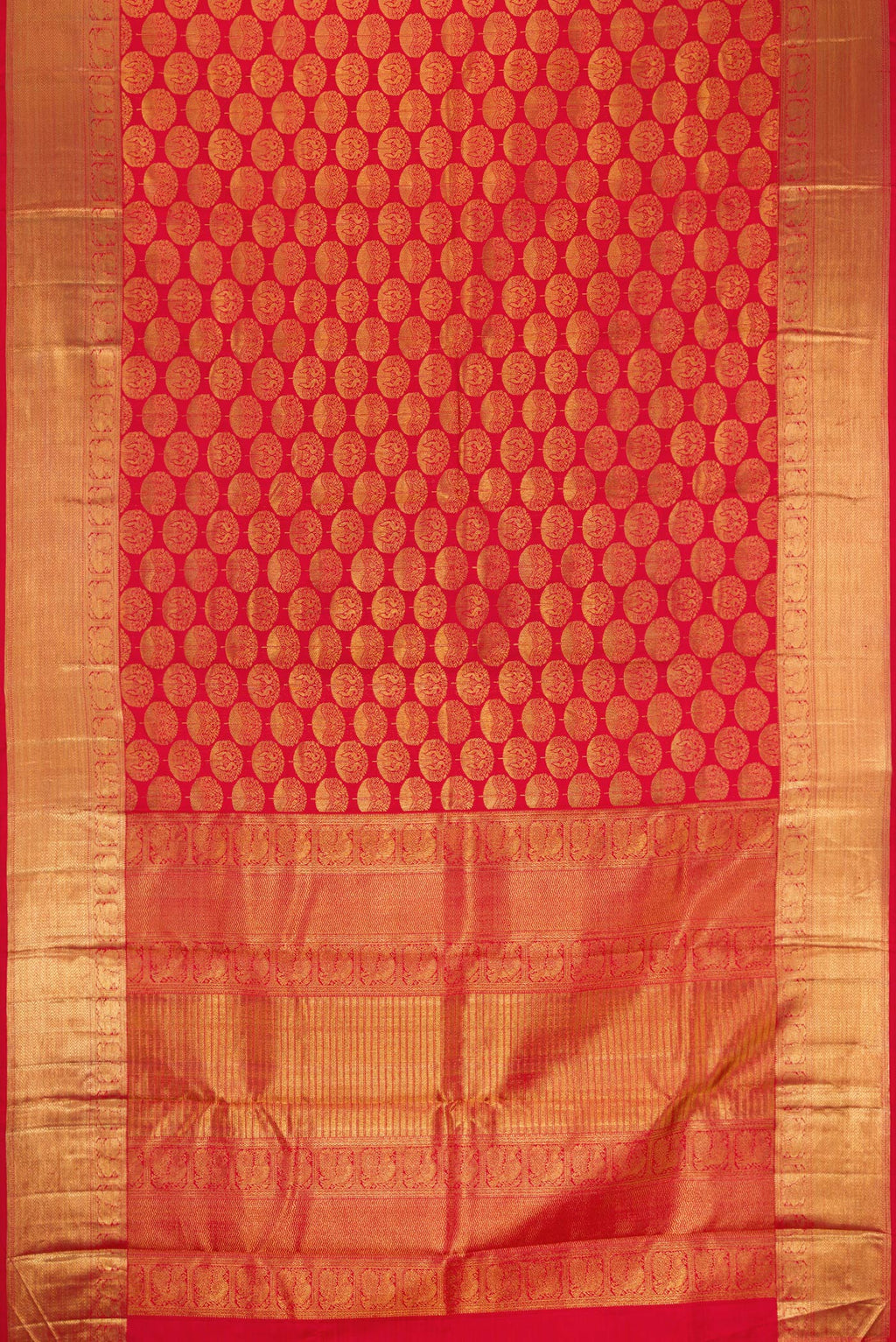 Flat view of Red Dual Tone Kanchipuram Silk Saree with Zari Brocade on the body and Zari Border. 