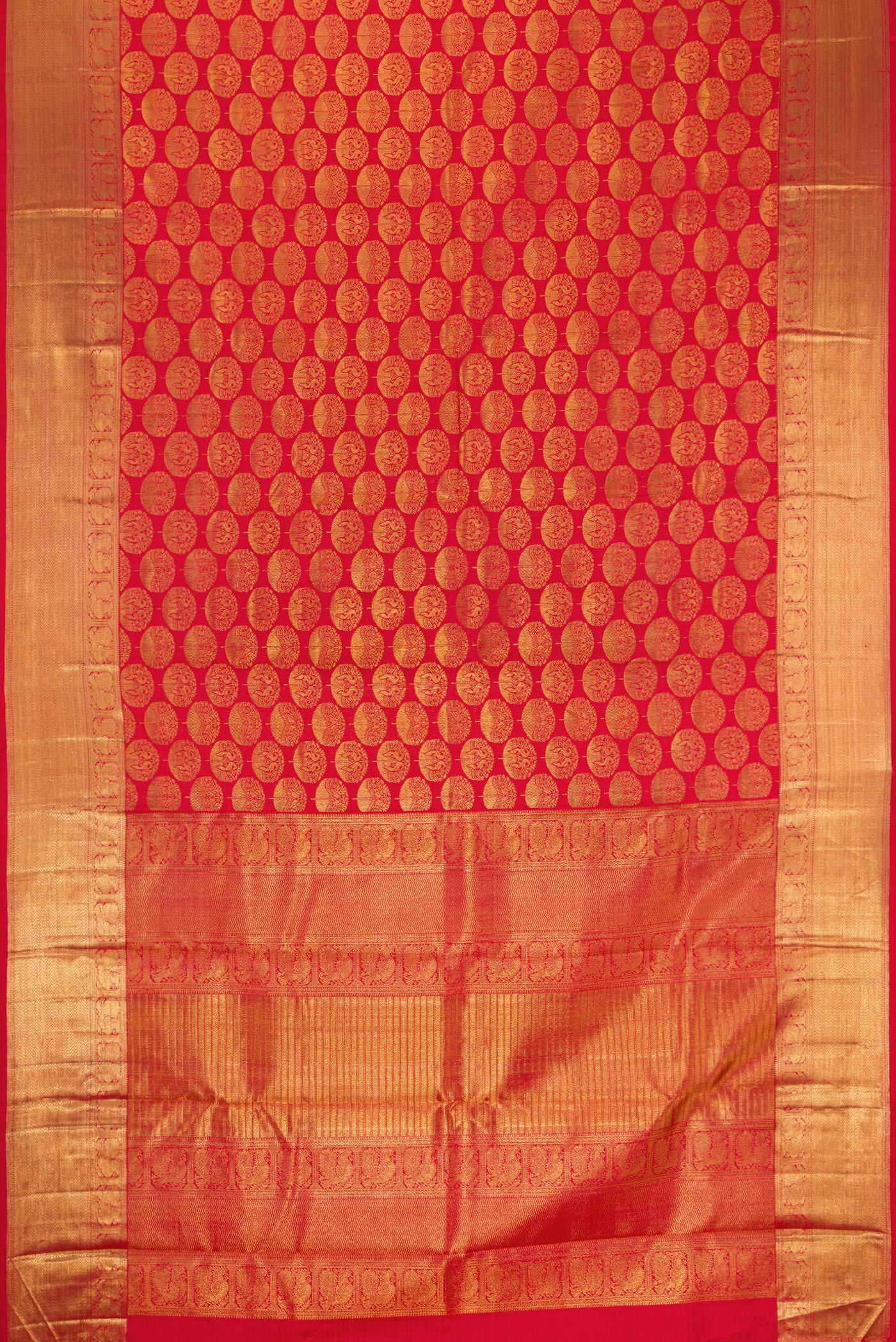 Flat view of Red Dual Tone Kanchipuram Silk Saree with Zari Brocade on the body and Zari Border. 