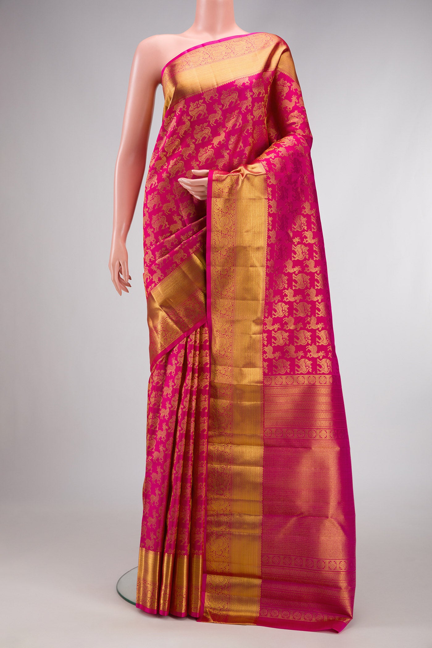 Pink Dual Tone Kanchipuram Silk Saree with Zari Brocade on the body and Zari Border.  displayed on a mannequin