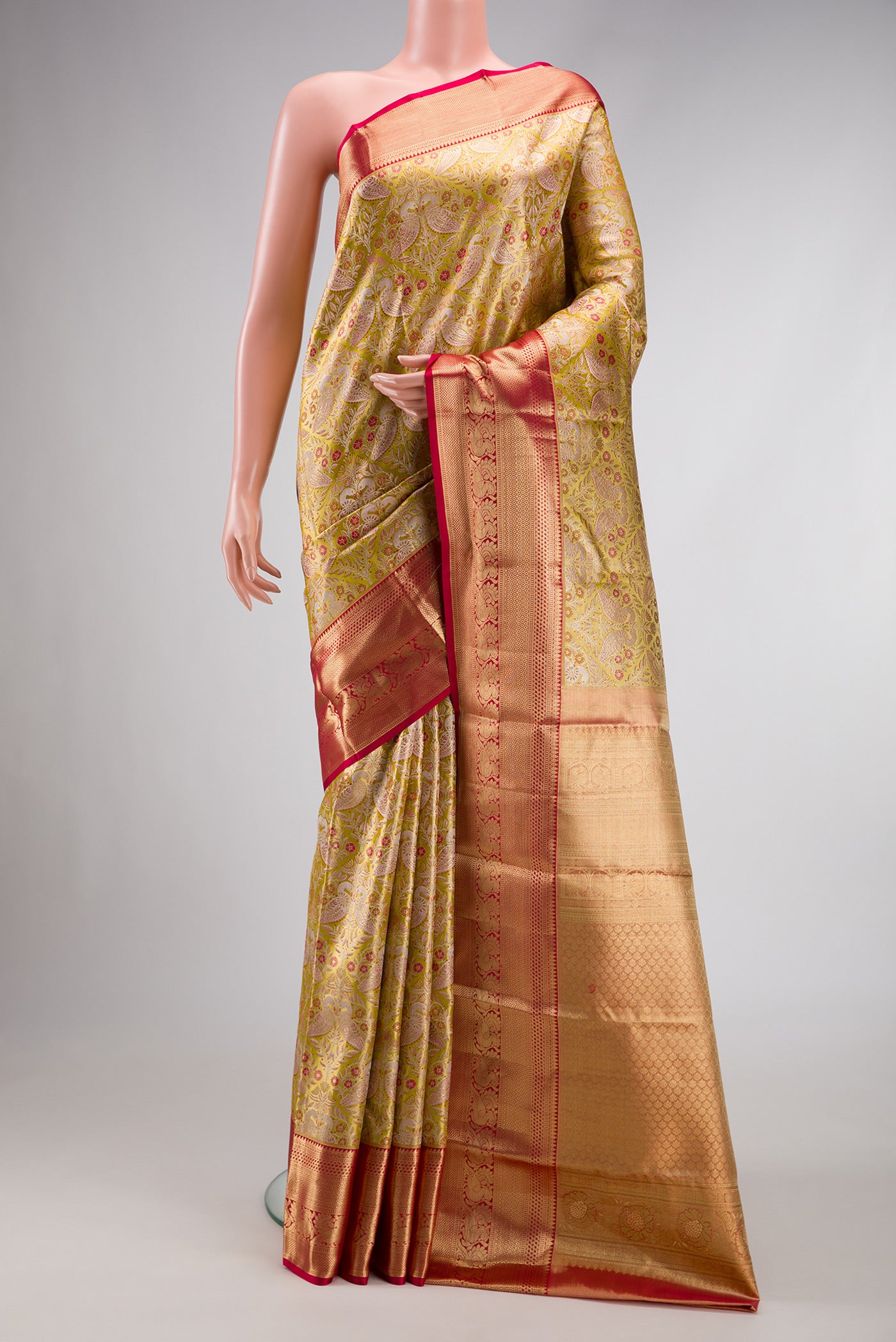 Light Green Dual Tone Kanchipuram Tissue Silk Saree with Zari Brocade on the body and Zari Border.  displayed on a mannequin