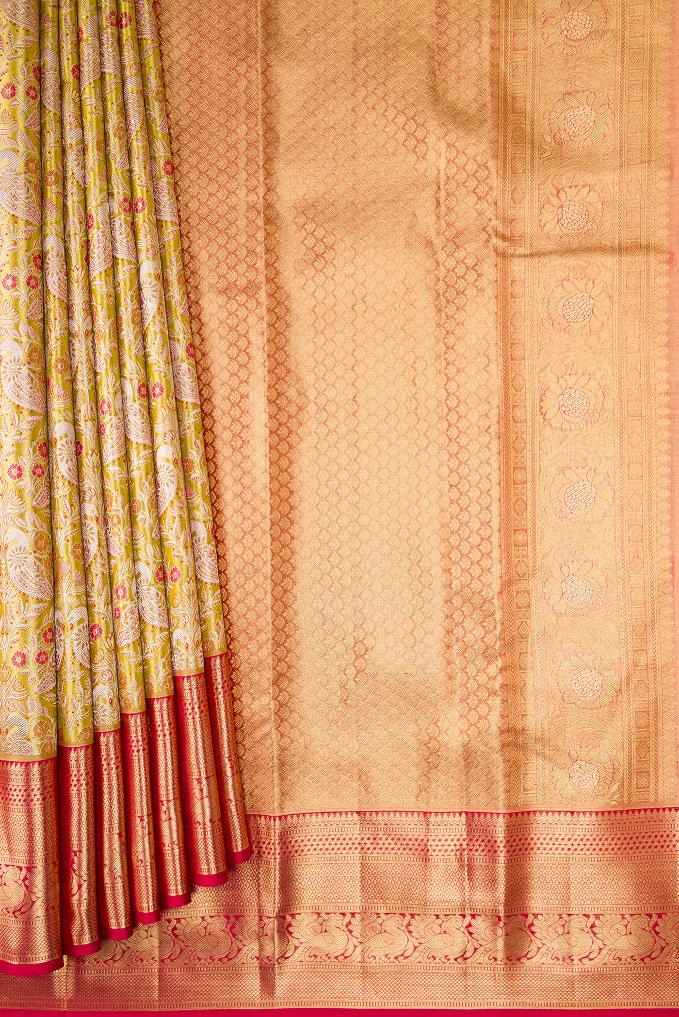 Pleats and pallu of Light Green Dual Tone Kanchipuram Tissue Silk Saree with Zari Brocade on the body and Zari Border. 