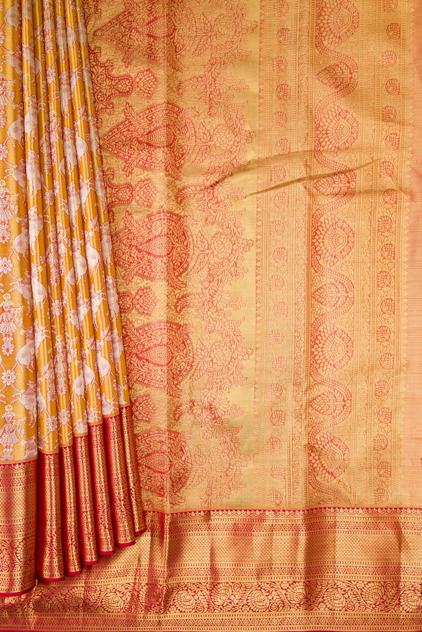Pleats and pallu of Gold Dual Tone Kanchipuram Tissue Silk Saree with Zari Brocade on the body and Zari Border. 